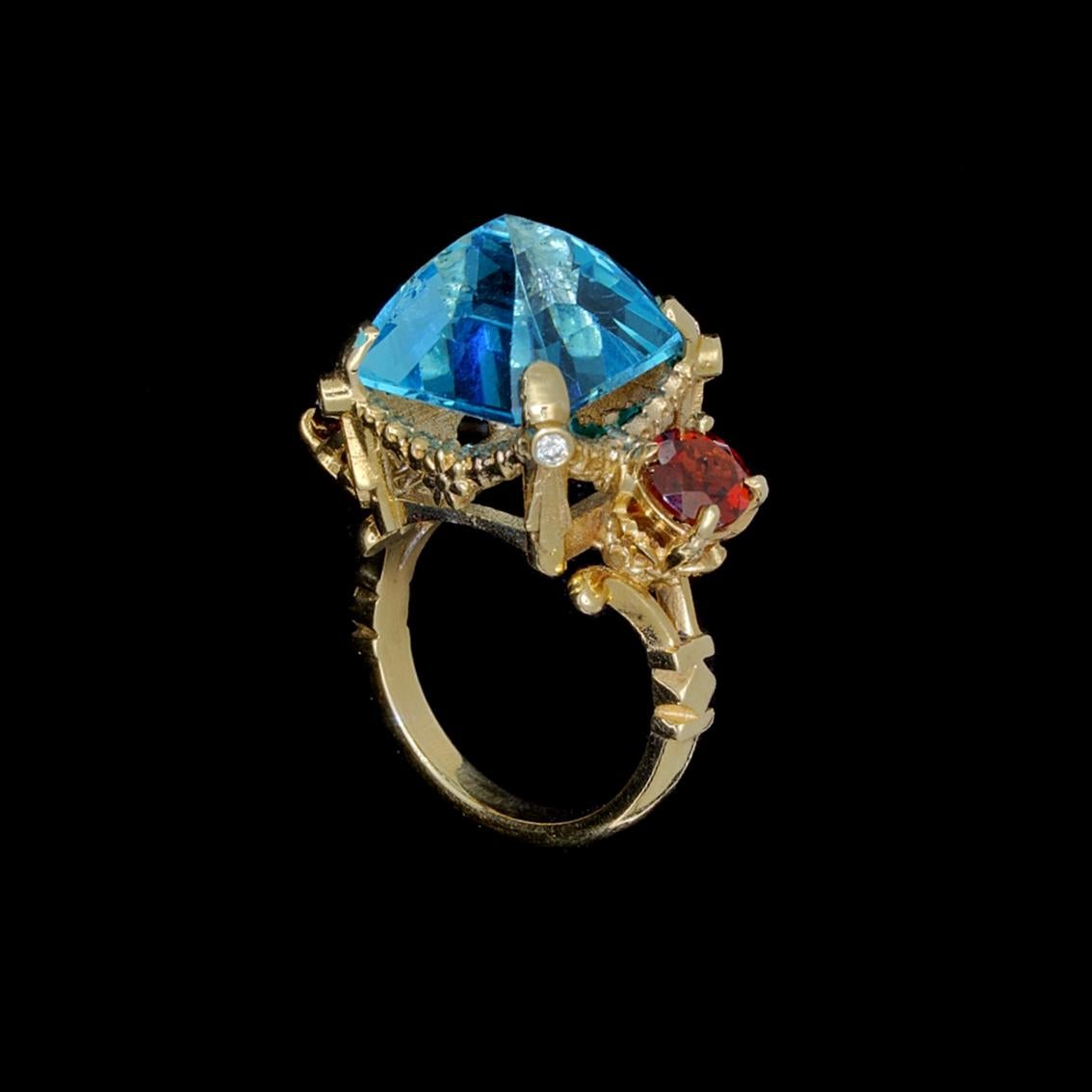 9 Karat Yellow Gold Ring with Blue Topaz, Garnets and Diamonds For Sale 1