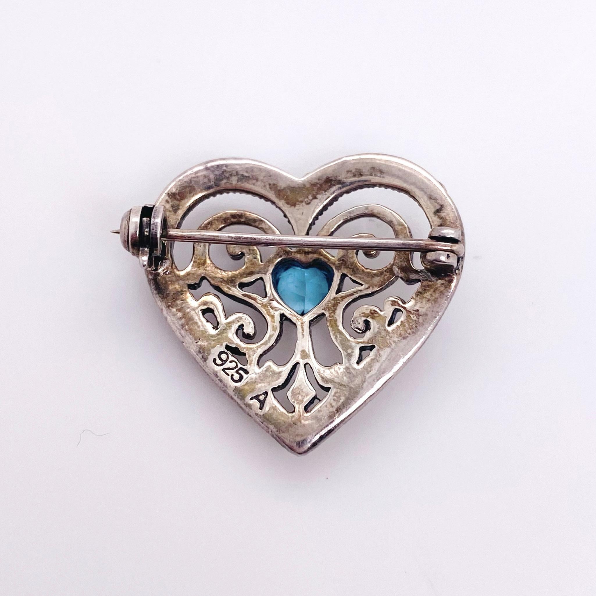 The details for this beautiful broach is listed below:
Metal Quality: Sterling Silver
Broach Shape: Heart
Broach Measurements: 45 x 43 millimeters
Gemstone: Blue Topaz
Gemstone Shape: Heart
Gemstone Color: Blue
Gemstone Number: 1
Gemstone