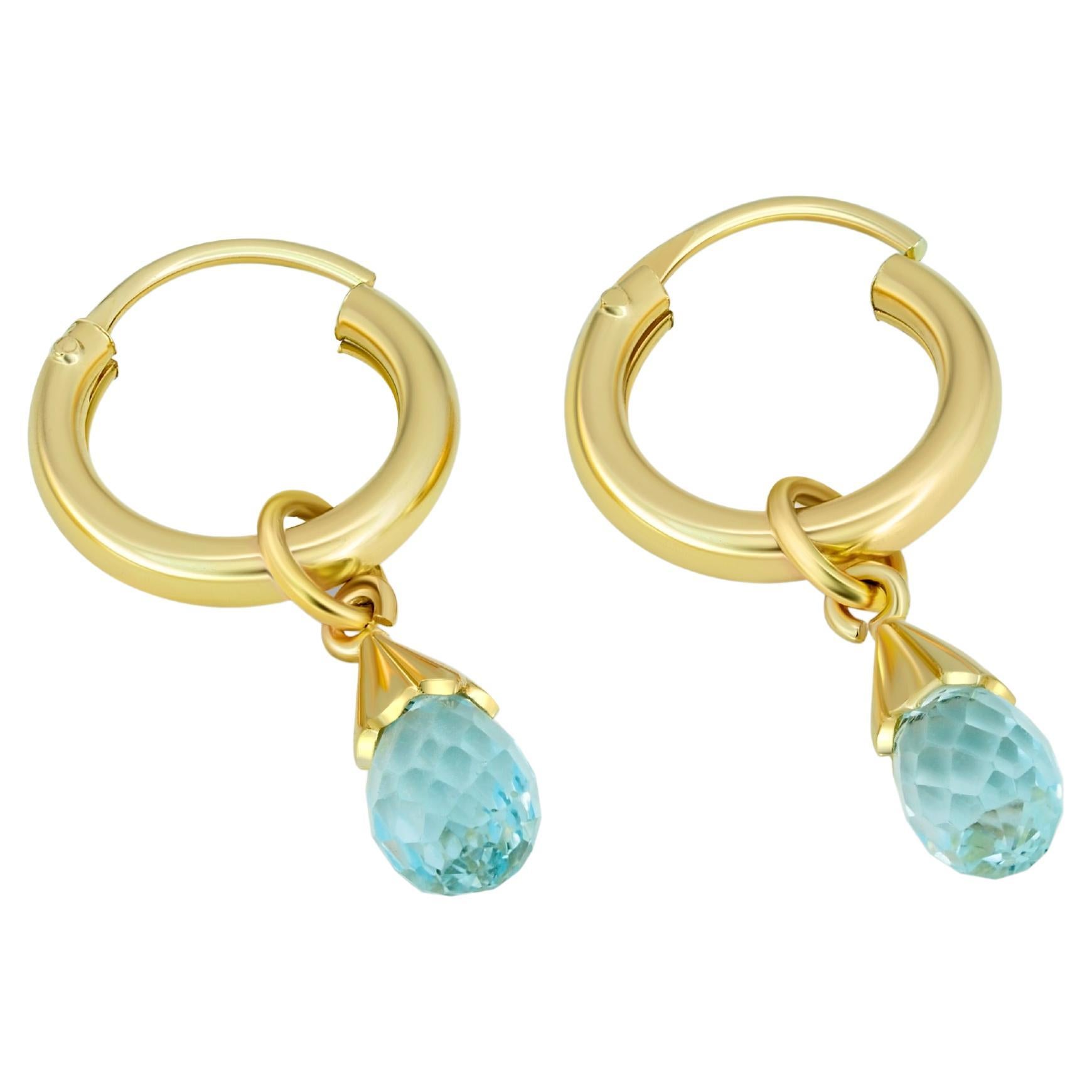 Topaz huggy hoop earrings.