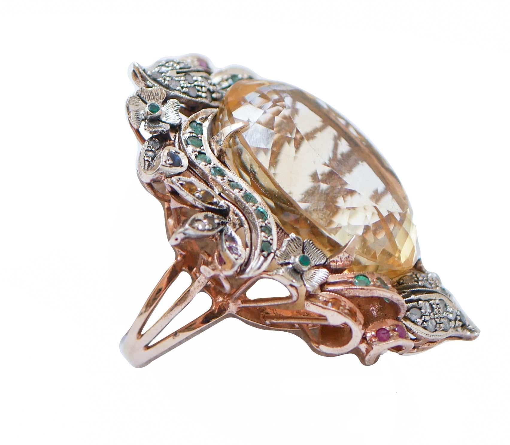 Magnificent ring in 9 kt rose gold and silver structure mounted with a central topaz surrounded by diamonds, rubies,emeralds and sapphires.
This ring was totally handmade by Italian master goldsmiths and it is in perfect conditions.
Diamonds 0.34