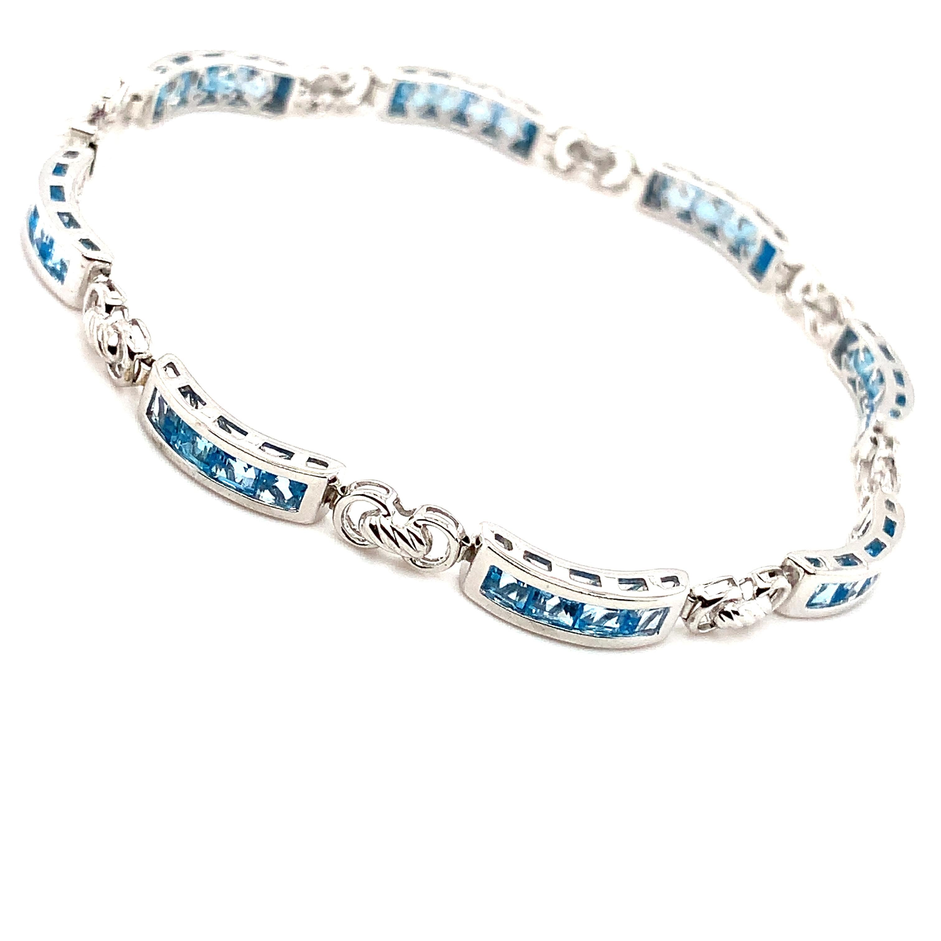 This stunning 5.00ct blue sky topaz 10k white gold tennis bracelet features a captivating yellow main stone that will add a touch of elegance to any outfit. The bracelet measures 7.5 inches in length and weighs 7.8g, making it a comfortable and