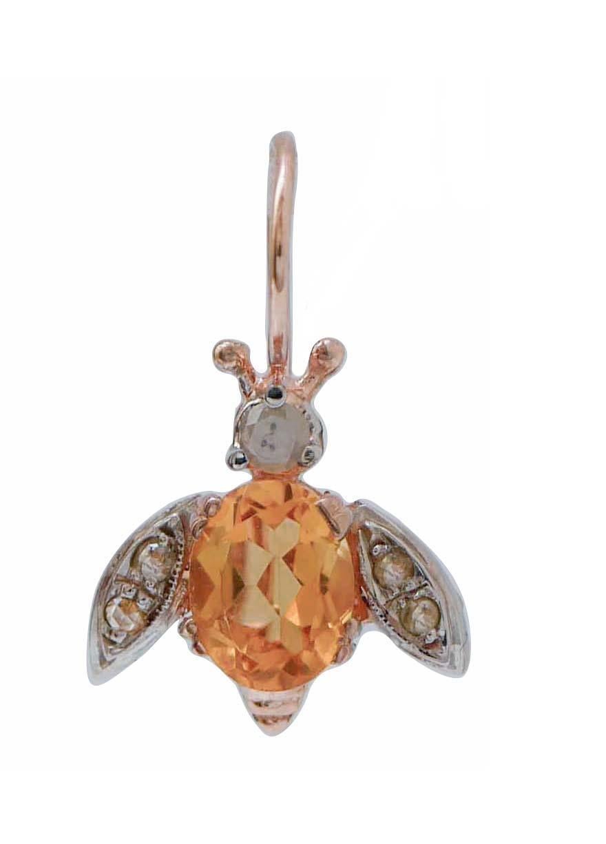 Particular fly shape earrings in 9kt rose gold and silver structure mounted with a diamond on the head; the body is mounted with a topaz and the wings are studded with diamonds.
These earrings are totally handmade by Italian master goldsmiths and