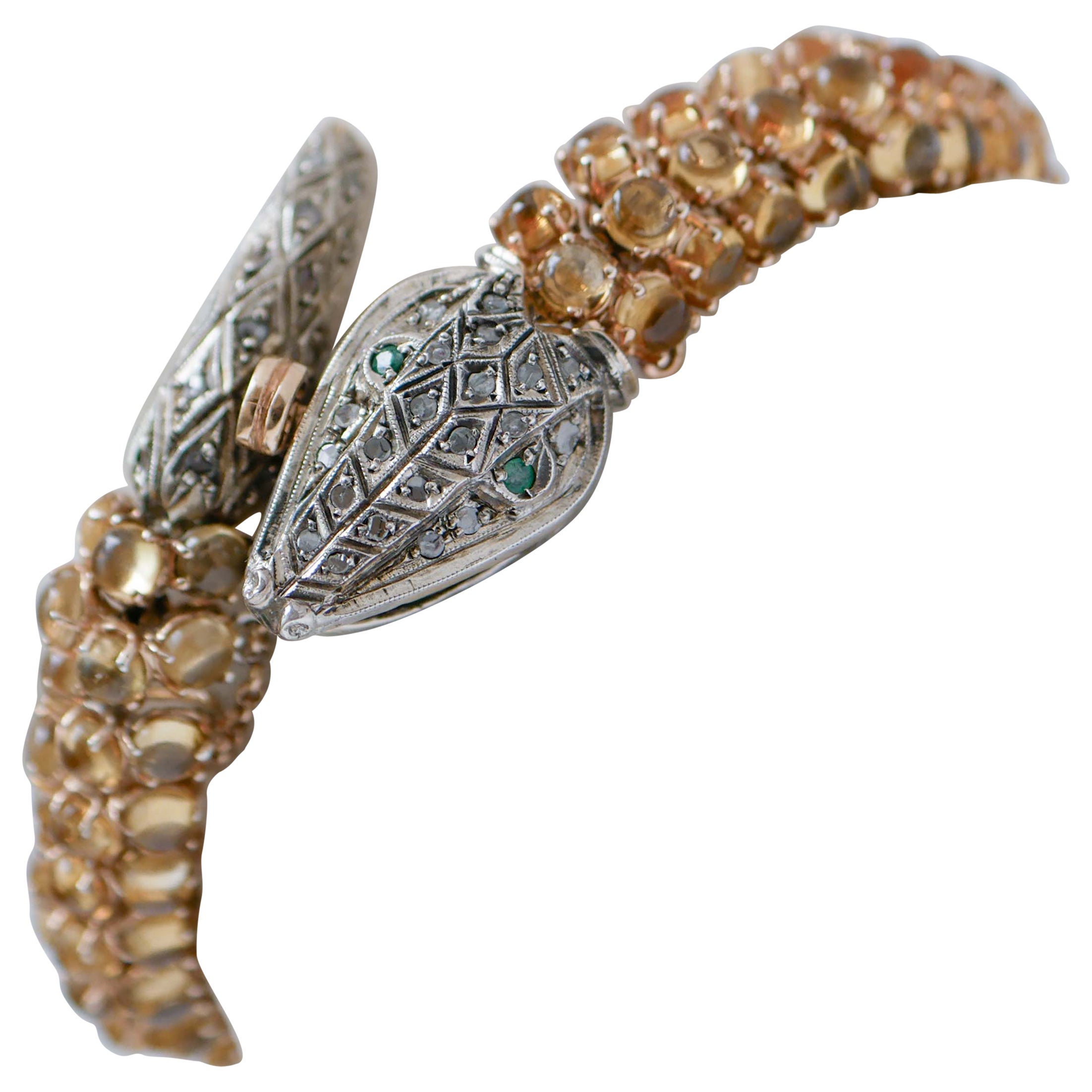 Pulsera con topacios, esmeraldas, diamantes, oro rosa y plata con diseño de serpiente.