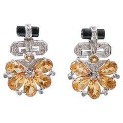 Ohrringe aus Platin und 14 Karat Weißgold mit Topas, Onyx, Diamanten und Platin.