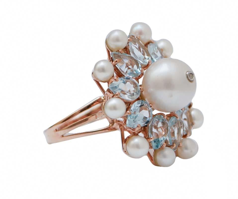 Fantastic ring in 14 kt rose gold and silver structure mounted with a central pearl with a diamond surrounded by topazs and little pearls.
This ring was totally hanmdade by Italian master goldsmiths and it is in perfect conditions.
Diamond 0.01