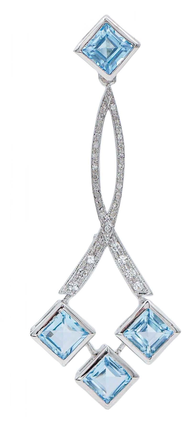 SHIPPING POLICY: 
No additional costs will be added to this order. 
Shipping costs will be totally covered by the seller (customs duties included).

Elegant dangle earrings in 14 kt white gold structure mounted with a topaz in the upper part; in the