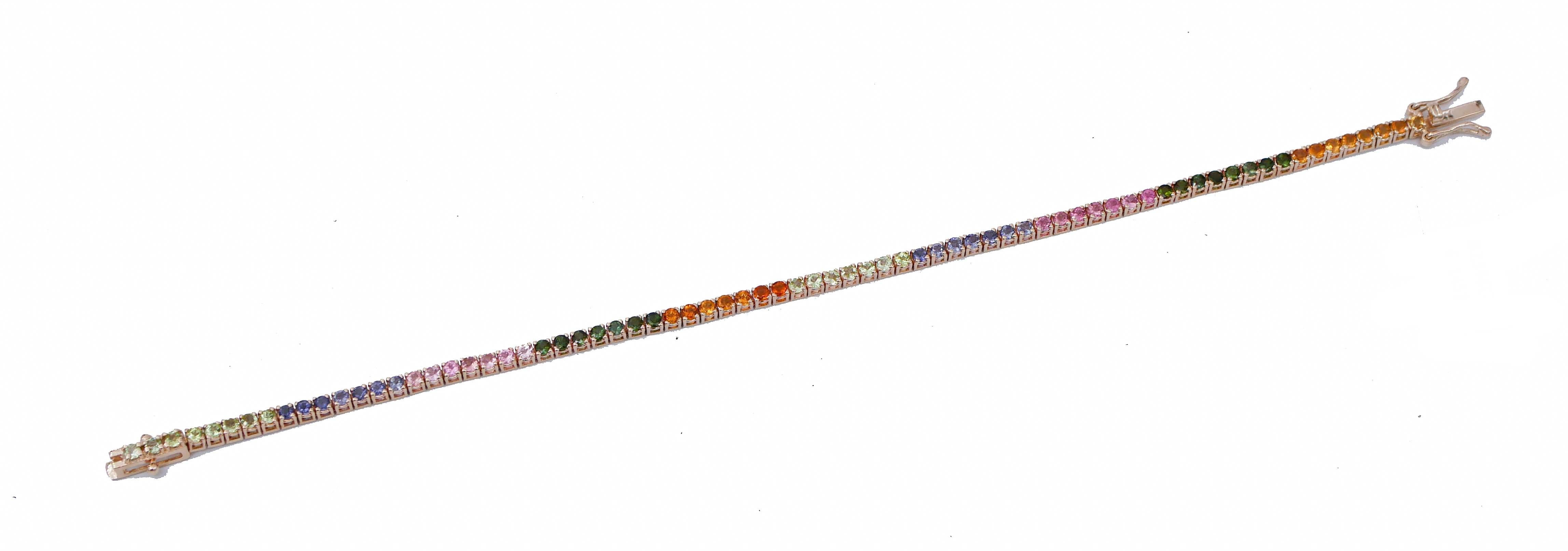 SHIPPING POLICY:
Shipping costs will be totally covered by the seller.

Fantastic tennis bracelet in 9 kt rose gold structure mounted with sections of tourmaline,topazs,iolite and amethysts.
Toumarline,Topazs,Amethysts,Garnets 3.08 ct
Total Weight