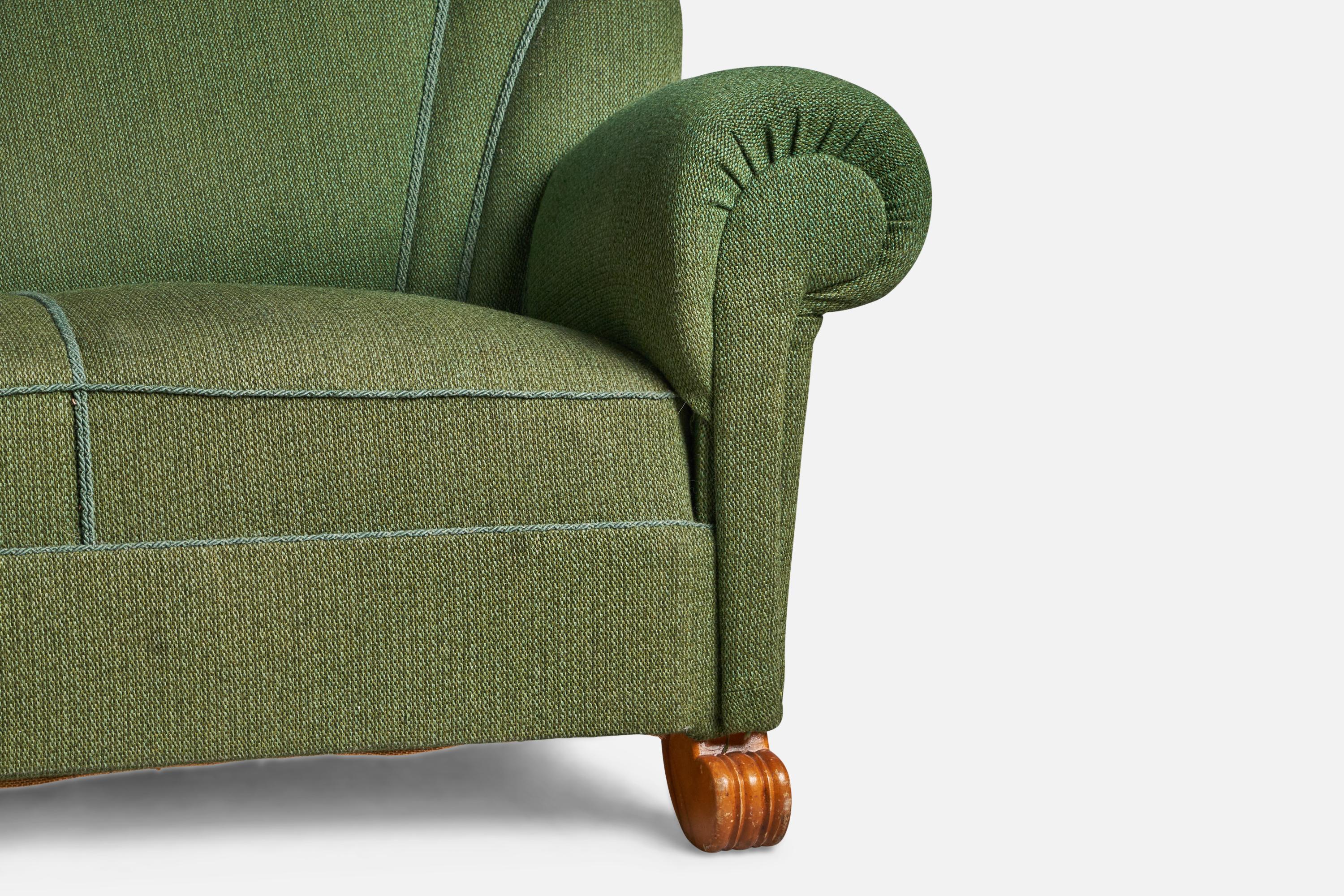 A green fabric and wood sofa designed by Tor Wolfenstein and produced by Ditzingers, Sweden, 1940s.

16.5” seat height