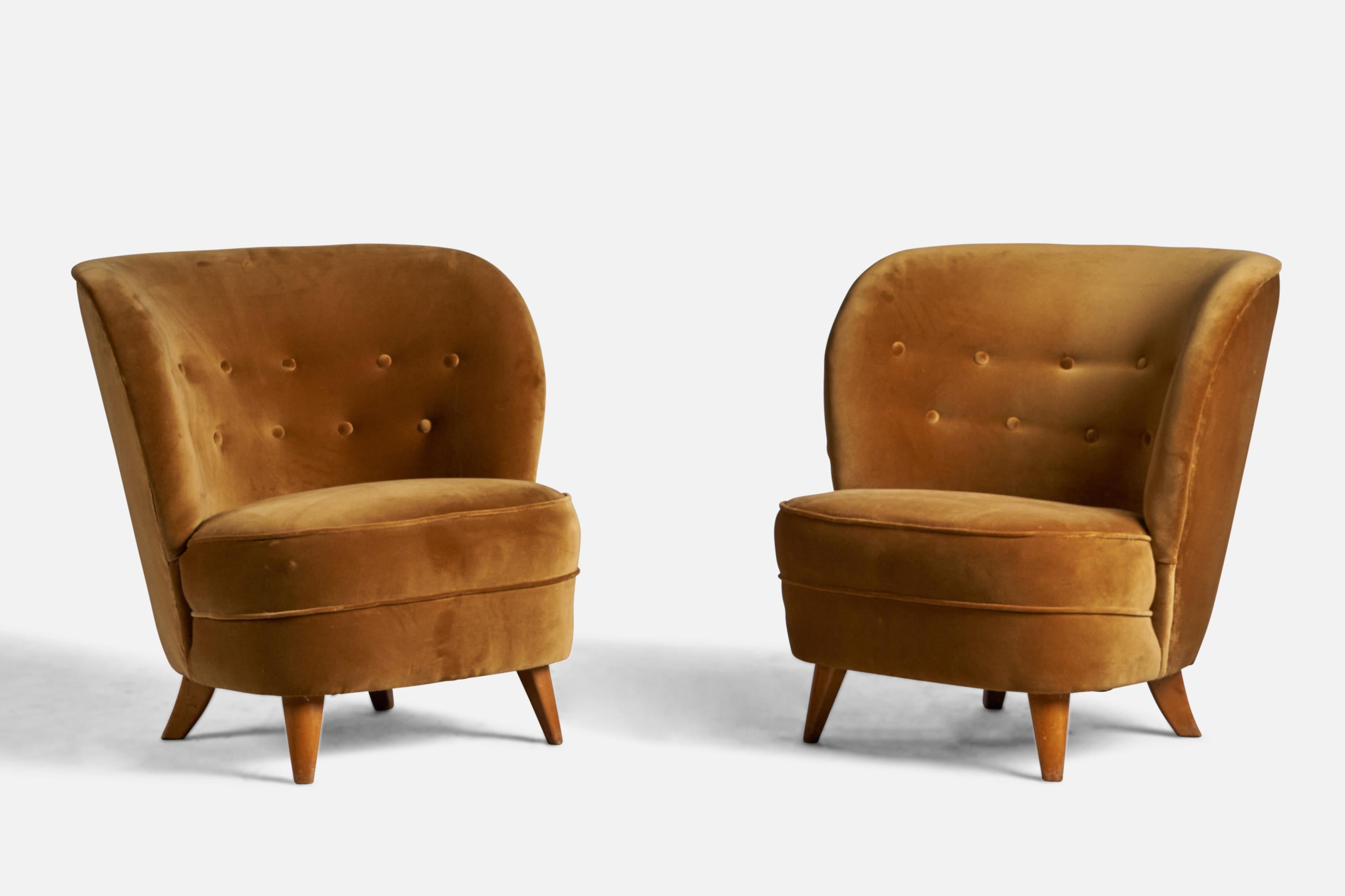 A pair of beige velvet and wood lounge or slipper chairs designed by Tor Wolfenstein and produced by Ditzingers, Sweden, 1940s.

Previously sold same model pairs carrying manufacturers metal plaque.

15.5” seat height

