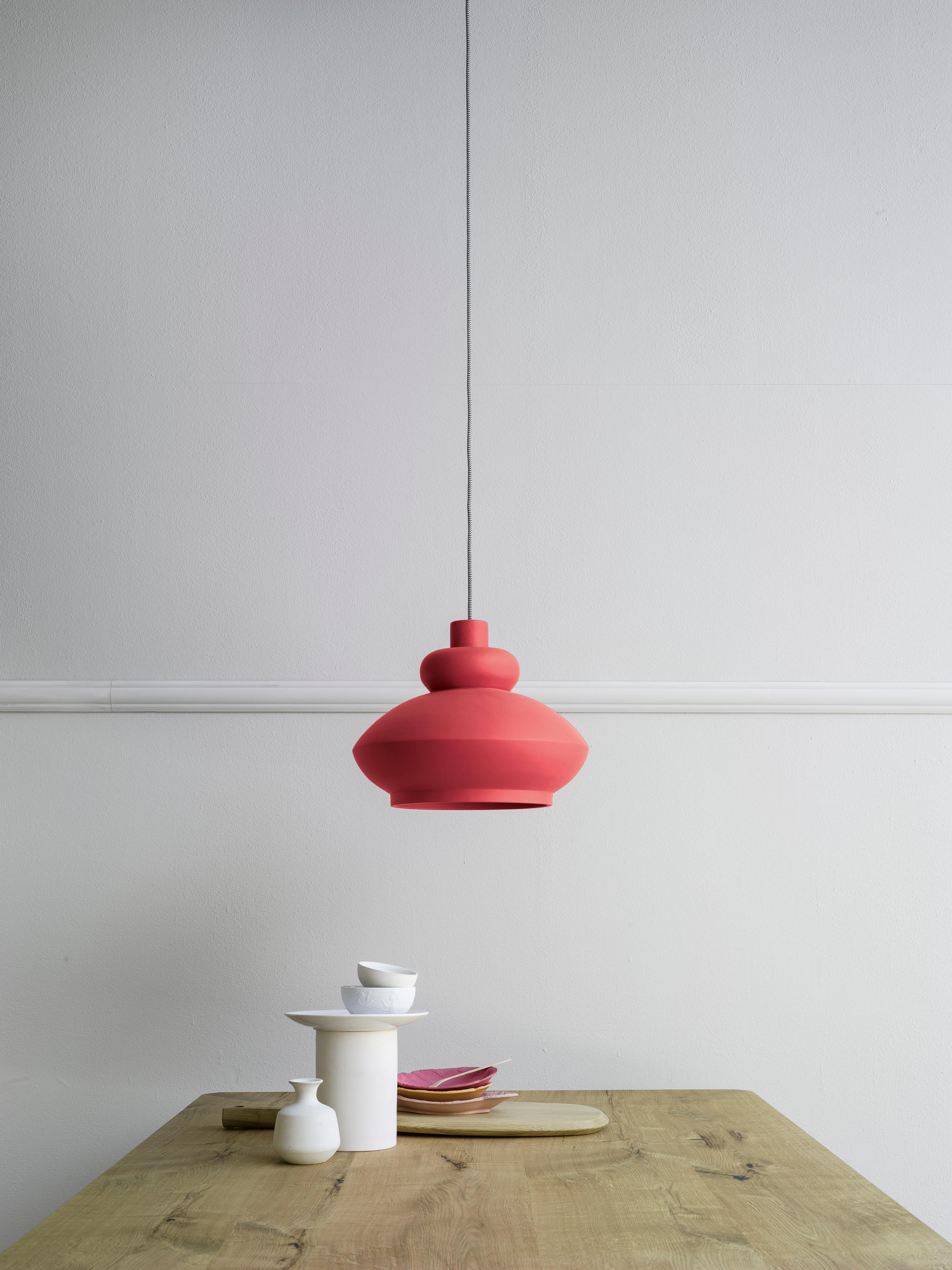 Tora, a ceramic pendant lamp in matte pastel colors, draws its inspiration from Arab lanterns and old oil lamps. Designed to be used individually as well as in clusters, in both residential and contract settings. Here you are shown Tora ceramic lamp