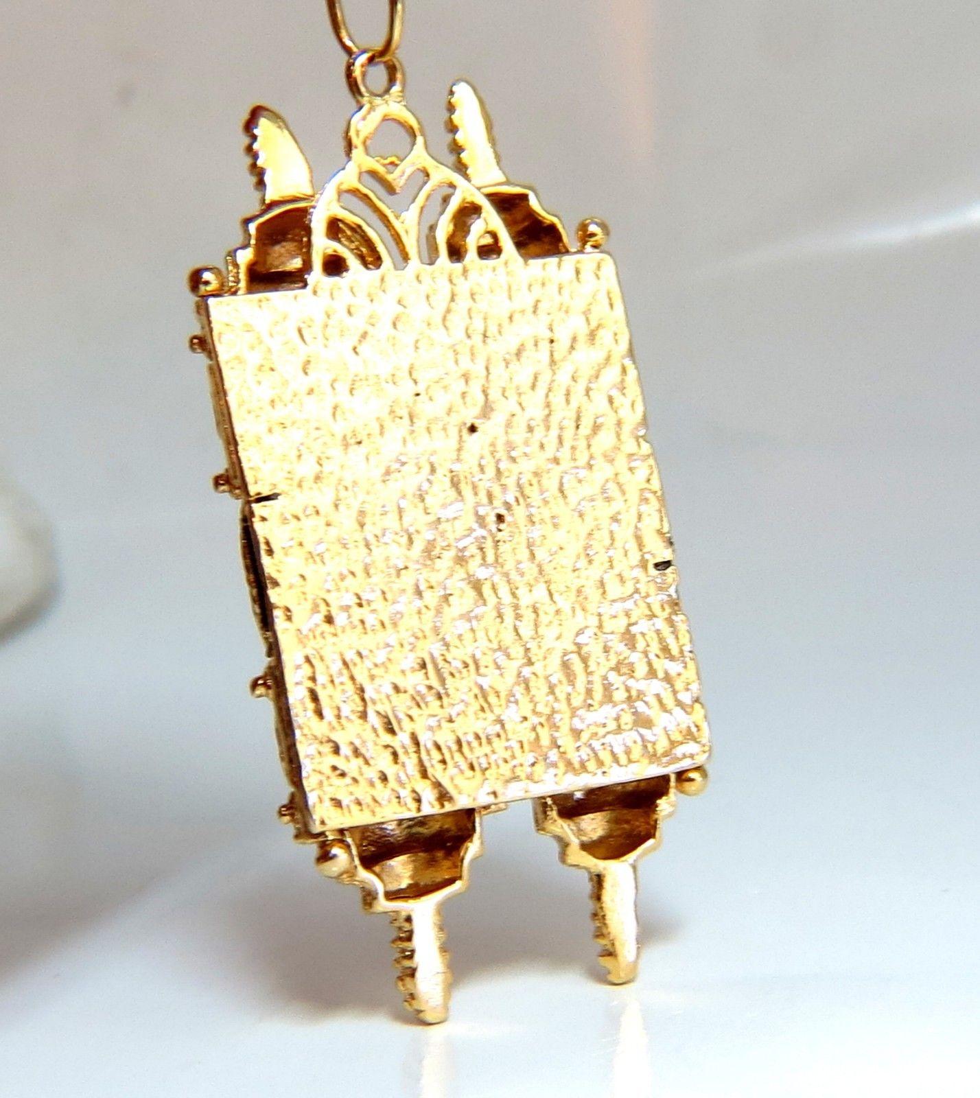 Functional Torah Necklace.

Torah Pendant: 1.87 x .85 inch

Necklace: 17 Inches (wearable length)

14kt. yellow gold 

23.6 Grams.