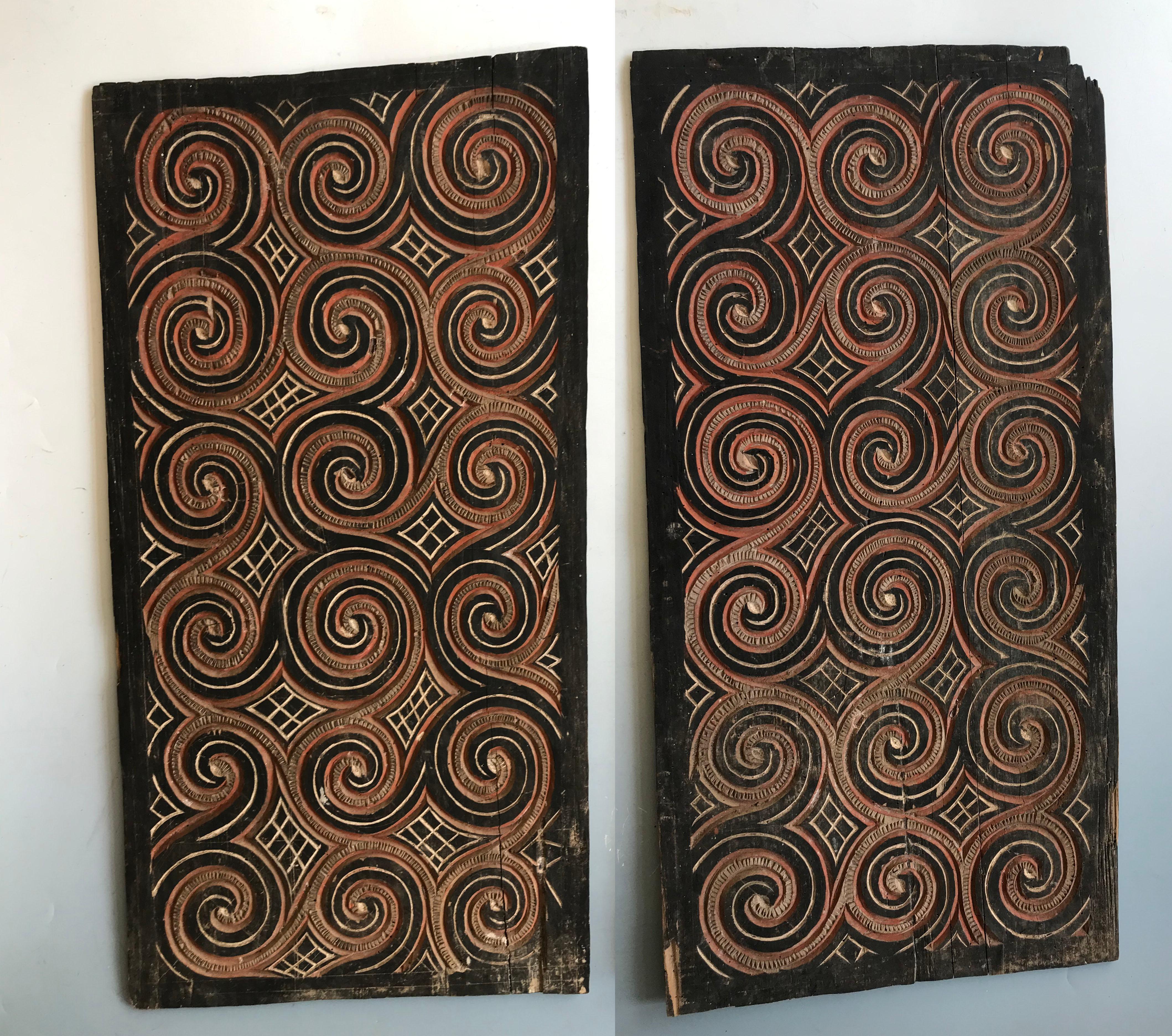 A wonderful pair of Toraja wood panels with carved swirling circular patterns painted with natural pigments,

Toraja People Central Highlands Sulawesi

Carved and painted wood from a house or ceremonial structure

65 x 34 cm 24 13.5 inches
