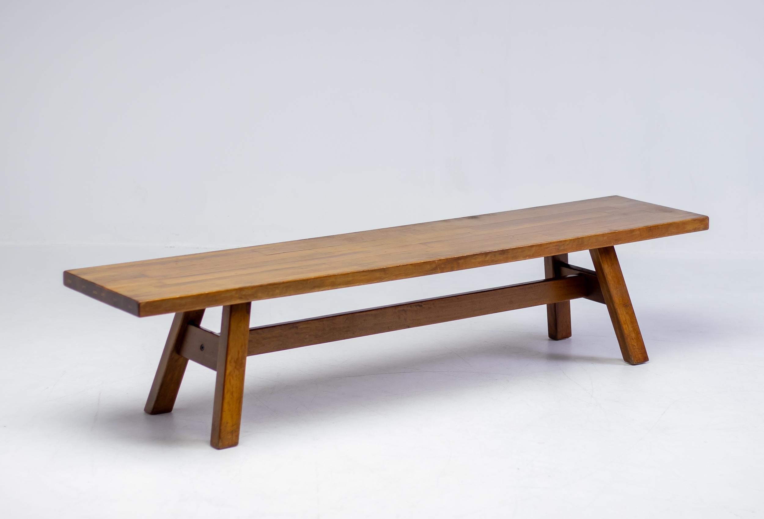 Bench from the Torbecchia series, designed by brutalist architect Giovanni Michelucci for Poltronova, 1964. 
Solid walnut structure with beautiful edge detail similar to Charlotte Perriand tables. 
This architectural piece will enlighten your