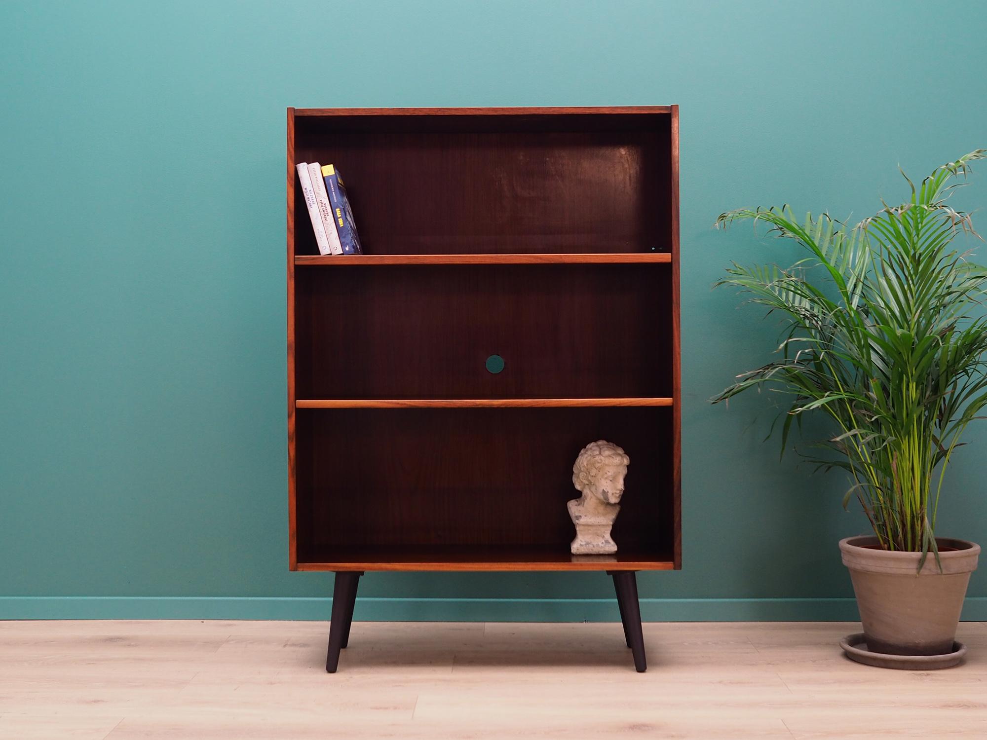 Fantastic bookcase / library from the 1960s-1970s. Danish design, Minimalist form. Project of Torben B. Nielsen. Surface of furniture finished with rosewood veneer. Shelves with height adjustment. Preserved in good condition (minor bruises and