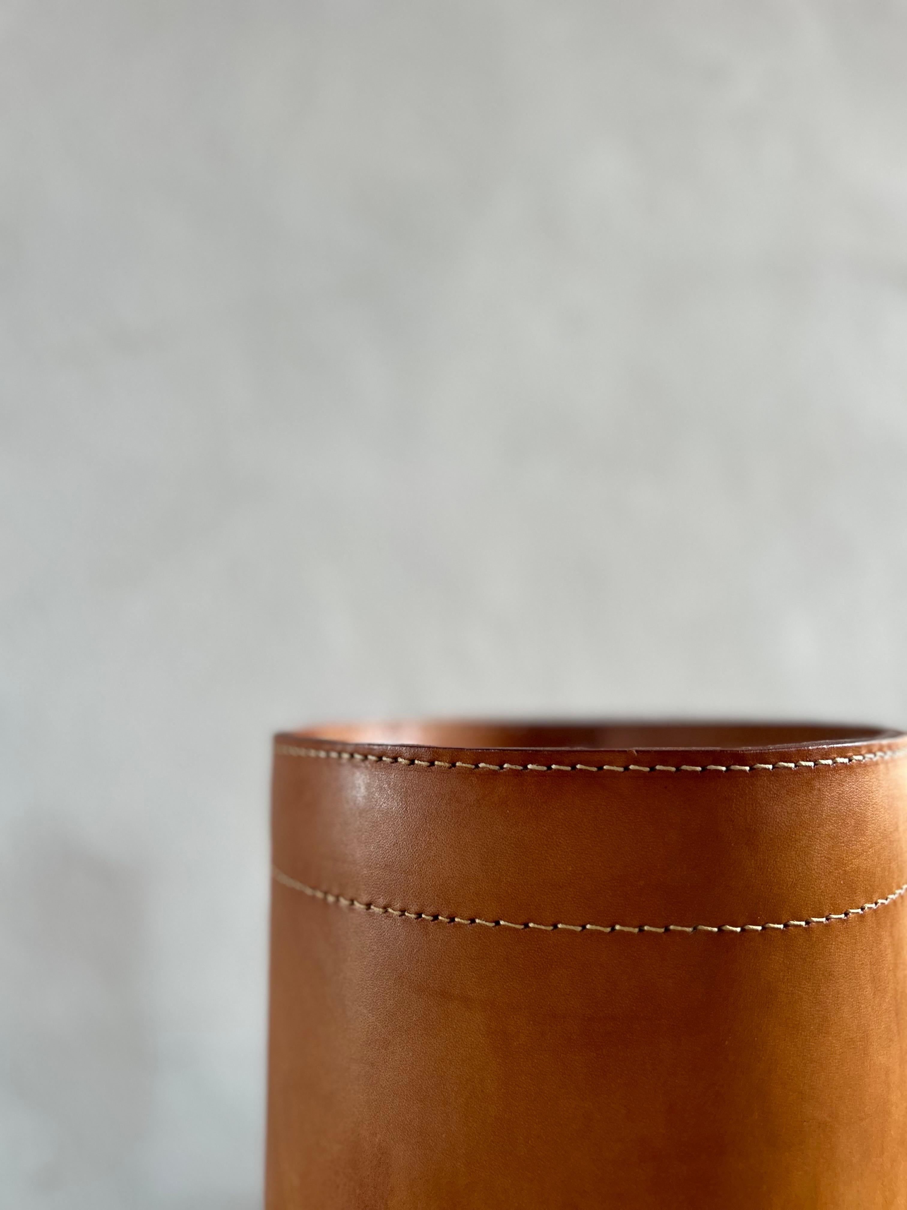 Wastepaper basket designed by Torben Ørskov in the 1960s. Renowned for his innovative designs and commitment to quality craftsmanship, Ørskov created pieces that seamlessly blended form and function, and this wastepaper basket is no