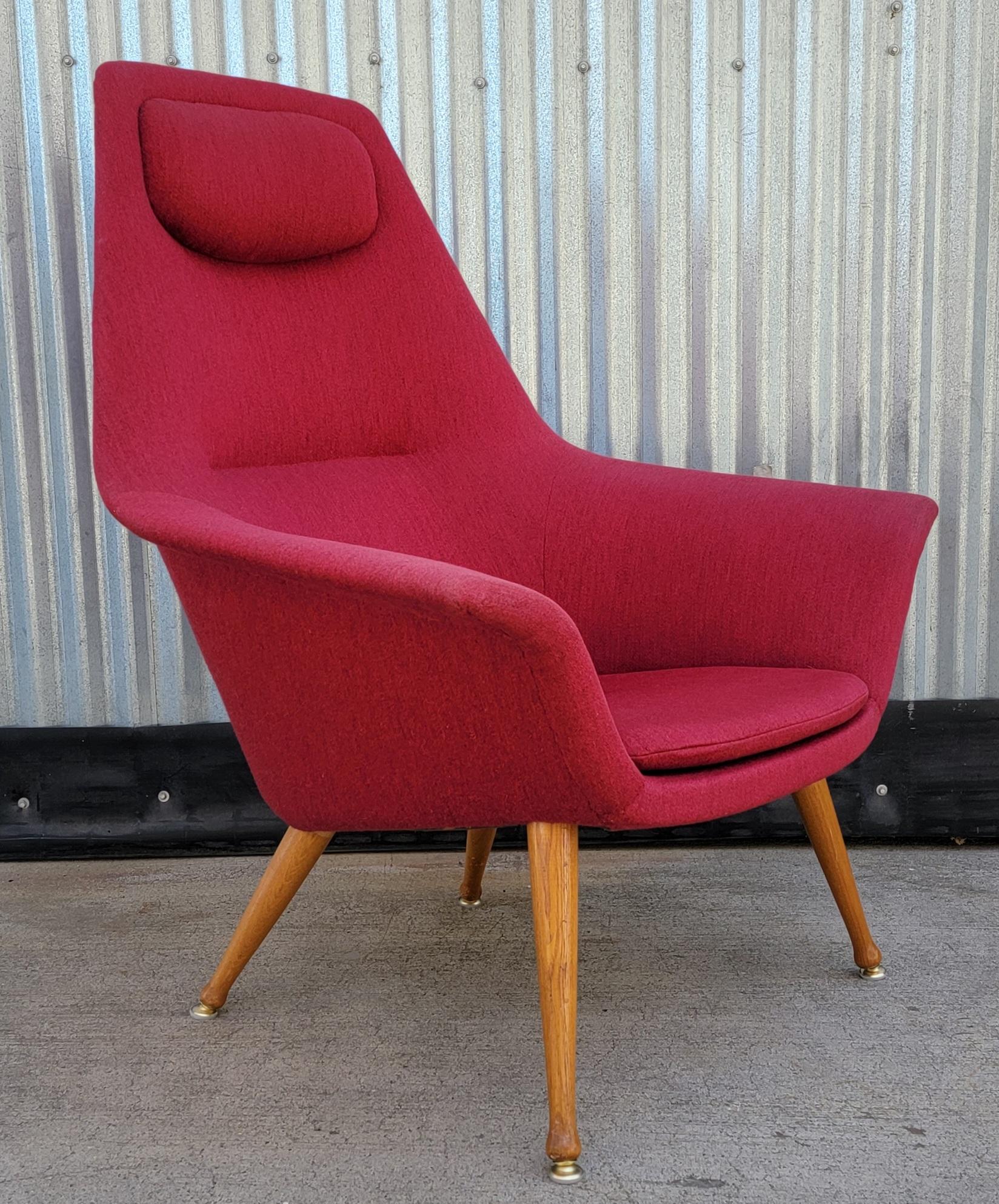 A vintage 1950's Scandinavian Modern upholstered lounge chair designed by Torbjorn Afdal, Norway. The 