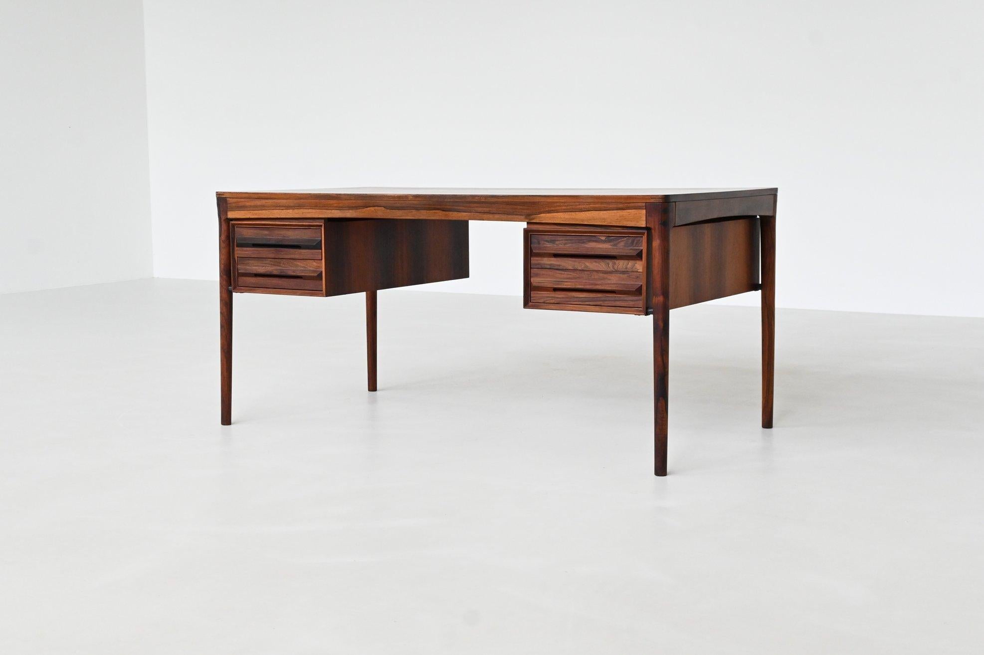 Beautiful executive desk designed by Torbjørn Afdal for Bruksbo, crafted in Norway in the 1960s. This masterwork of Scandinavian design, exemplifies the harmony of functionality and refined elegance. Made from richly grained rosewood, the desk