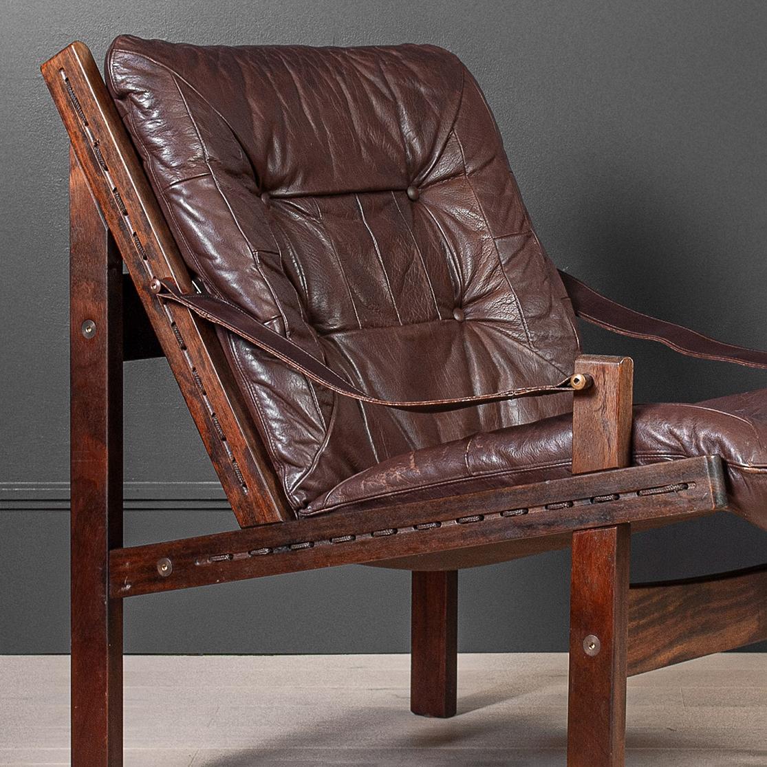 A classic Nordic Torbjorn Afdal Hunter chair produced by Bruksbo, Norway circa 1960.
Original leather and walnut frame. High back version also available - see our listings.
Very comfortable indeed.
Enquire for international shipping options.