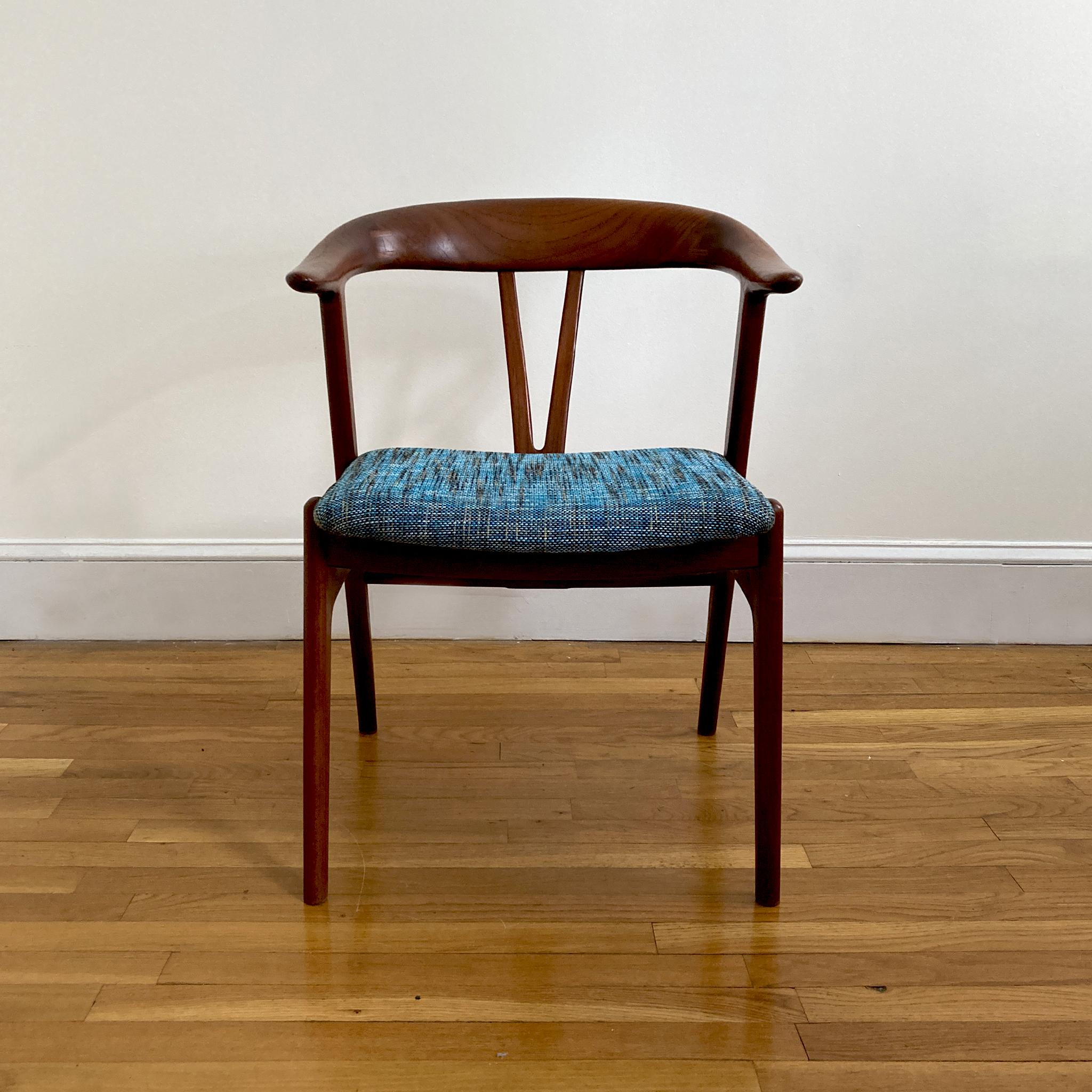 Stunning Form chair by Norwegian Torbjørn Afdal. This piece was produced by Bruksbo, circa 1958. The chair is pleasing to look at from every angle. The teak woodwork features joins in the curved seat back. This piece has been reupholstered in a