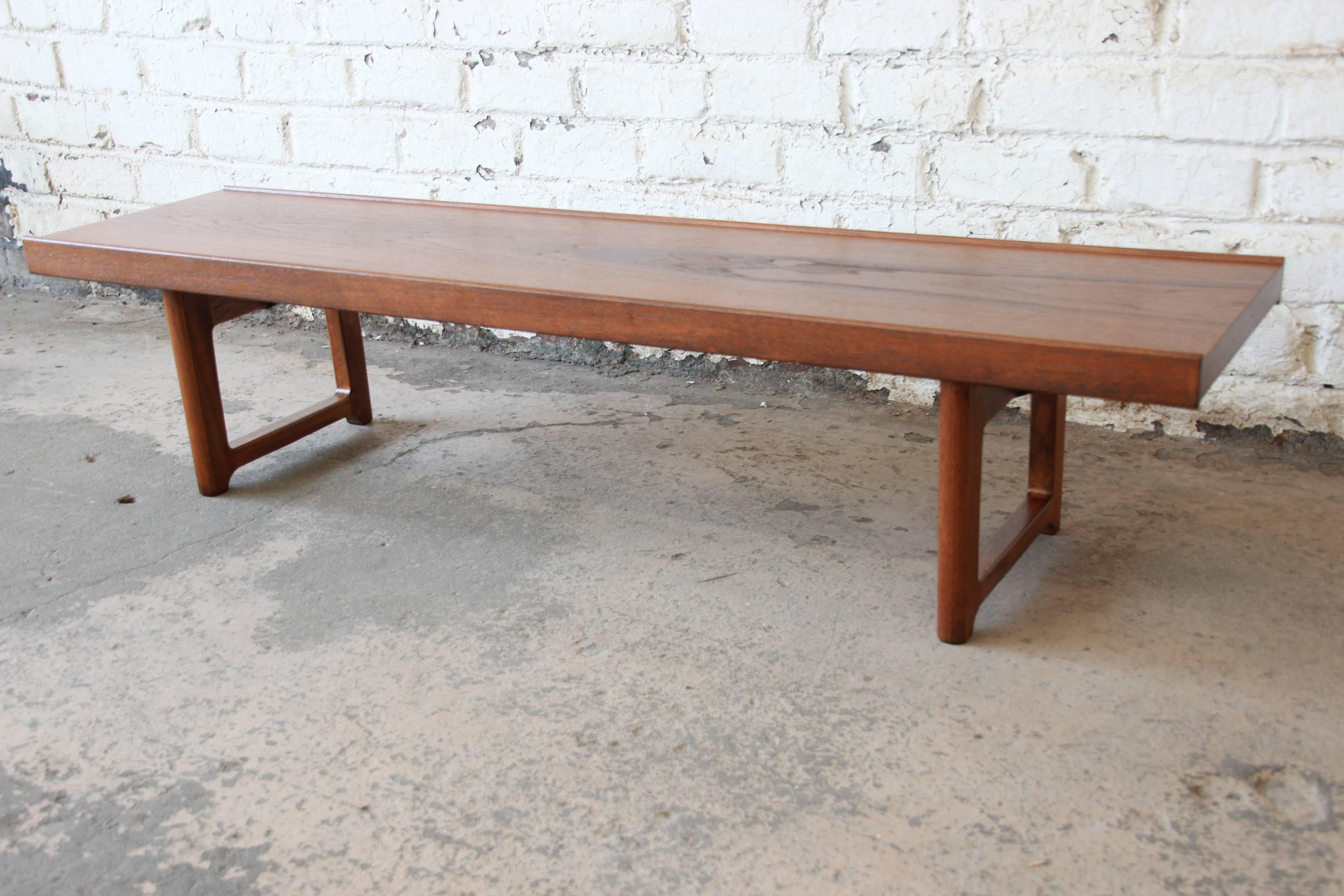 Offering a newly restored Torbjørn Afdal for Bruksbo teak bench or coffee table. The Norwegian made bench has mid Scandinavian lines with a distinct teak wood grain. The bench is newly refinished and in excellent condition.