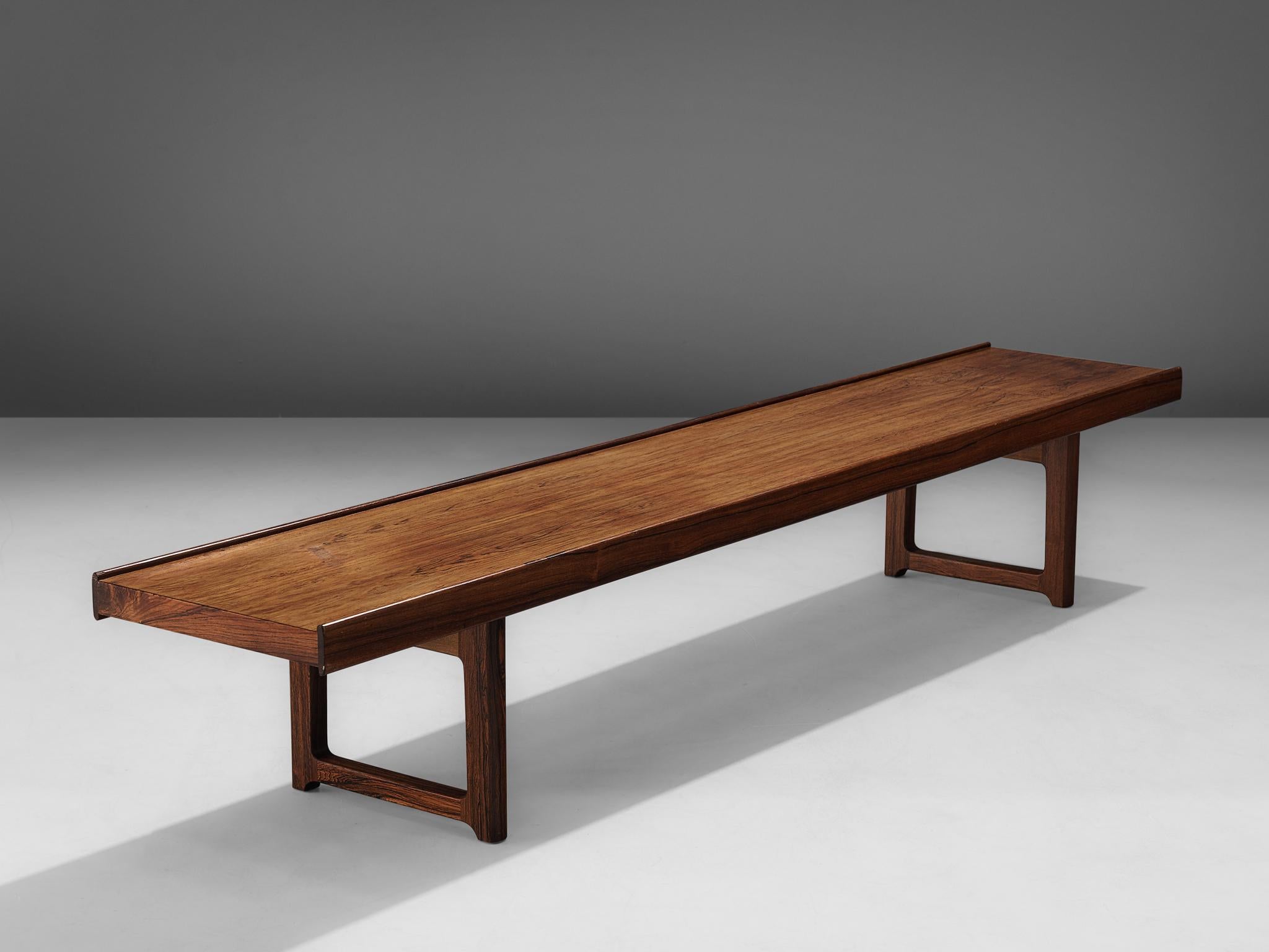 Torbjørn Afdal for Burksbo Mellemstrands Trevareindistri Norway, 'Krobo', side table or bench, rosewood, Norway, 1960s. 

The 'Krobo' bench by Afdal is made out of rosewood the piece is one of the Classic Norwegian designs of the 1960s. It has two