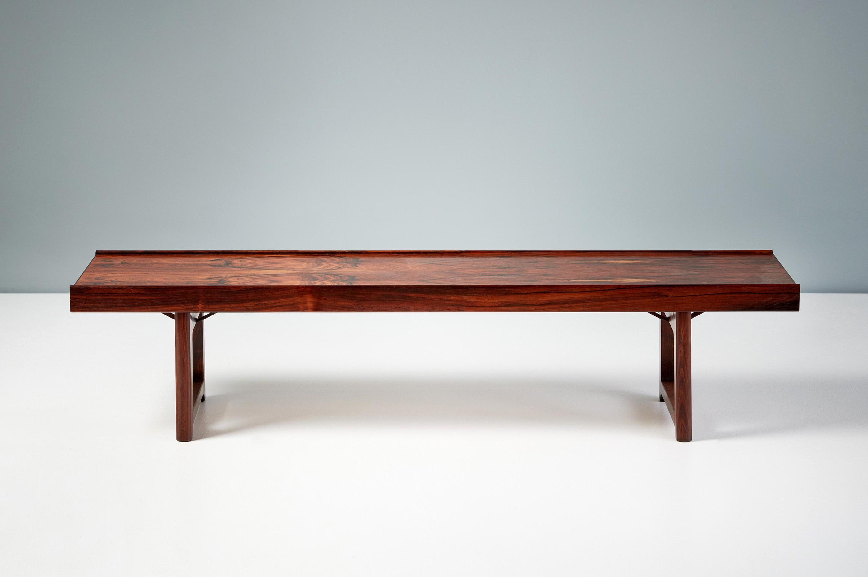 Torbjorn Afdal  - Krobo Bench, c1960

Highly figured rosewood bench or coffee table from Norwegian designer Torbjorn Afdal for Bruksbo. Produced c1960s with veneered top and solid legs.

H: 34cm  /  D: 37cm  /  W: 150cm 
 