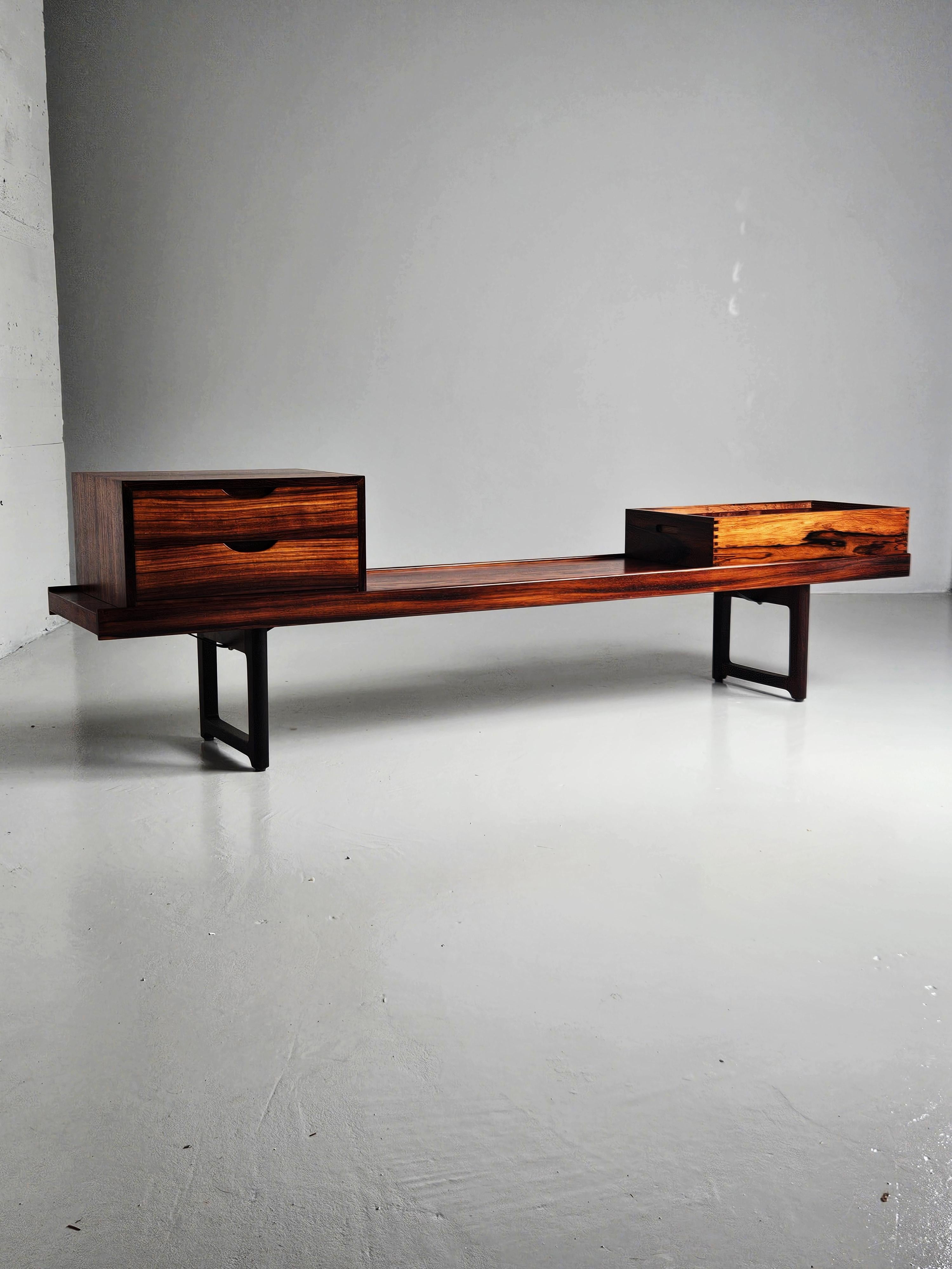 ’Krobo’ bench designed by Torbjørn Afdal. Produced in Norway in the 1960s for 
Mellemstrands Bruksbo. 

Made in rosewood. Modular and comes with an original plant box and a chest with two drawers.