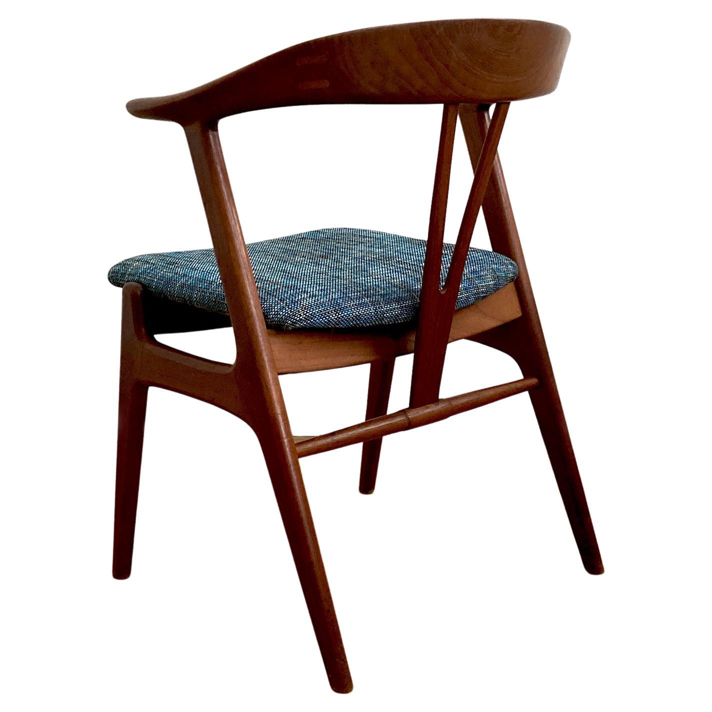 Stunning Form chair by Norwegian Torbjørn Afdal. This piece was produced by Bruksbo, circa 1958. The chair is pleasing to look at from every angle. The teak woodwork features joins in the curved seat back. This piece has been reupholstered in a