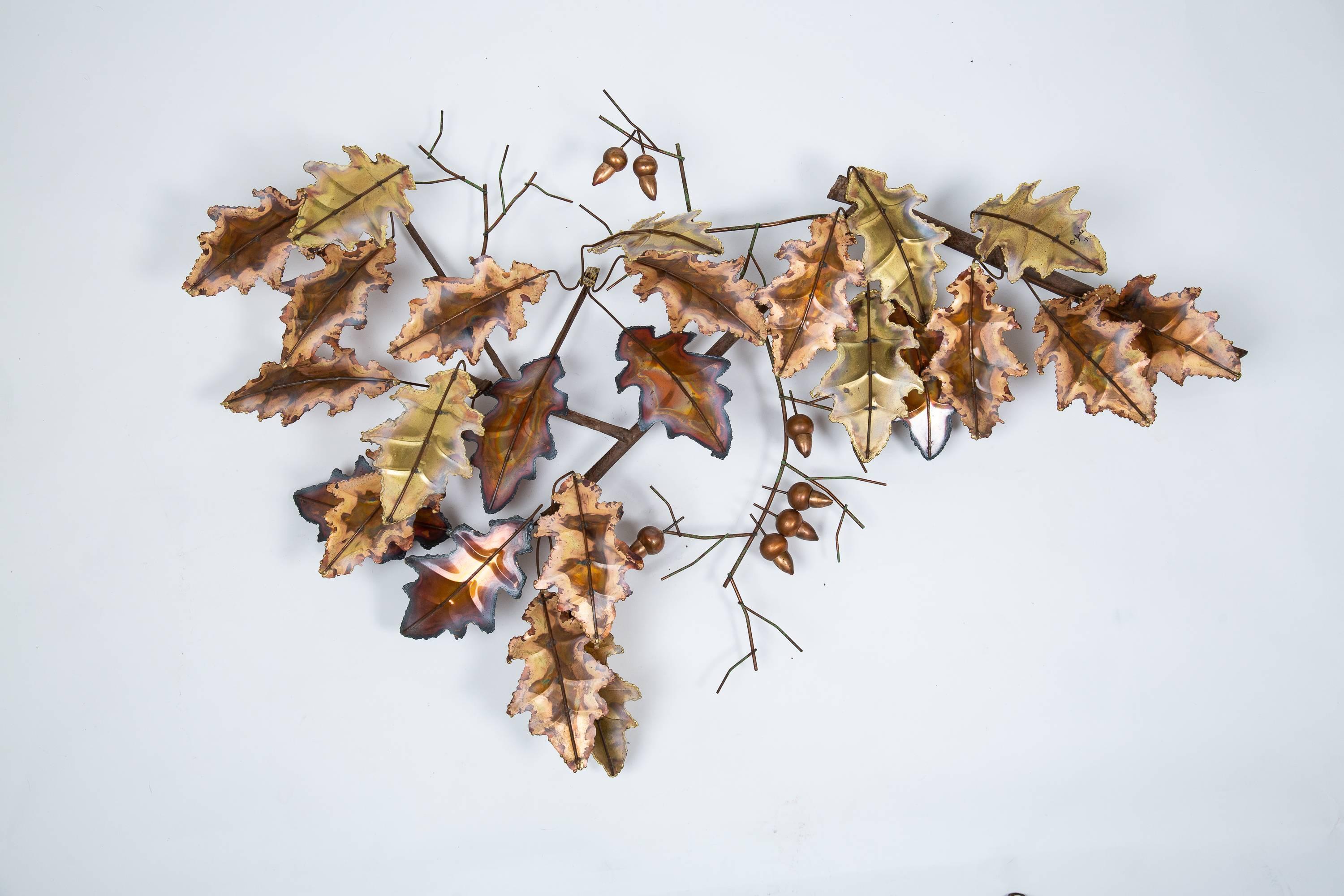 Large Curtis Jere torch cut and patinated brass and copper oak leaf with acorns wall sculpture, mounted on handcrafted iron frame. Signed, C. Jere, '73.