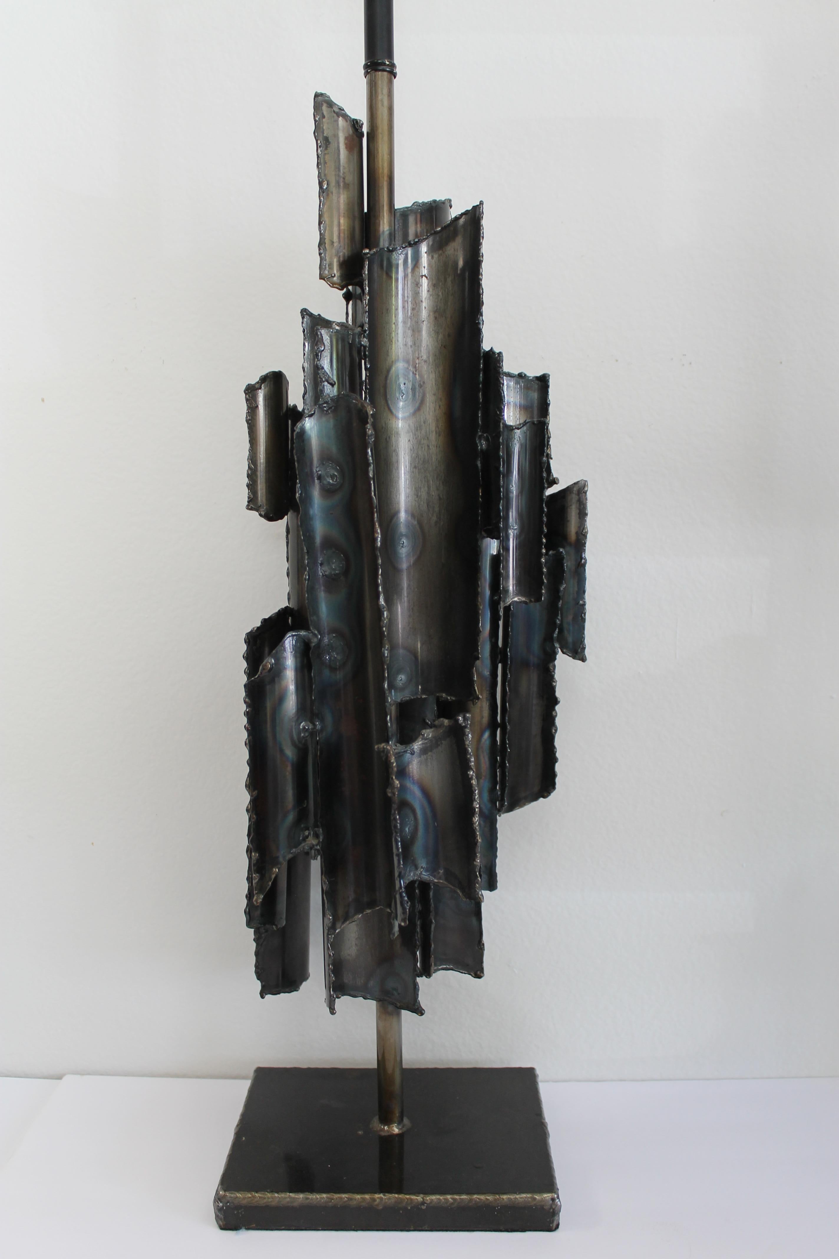 Torch cut brutalist lamp by Marcello Fantoni. Marked Marcello Fantoni, Italy. Lamp measures 10.5