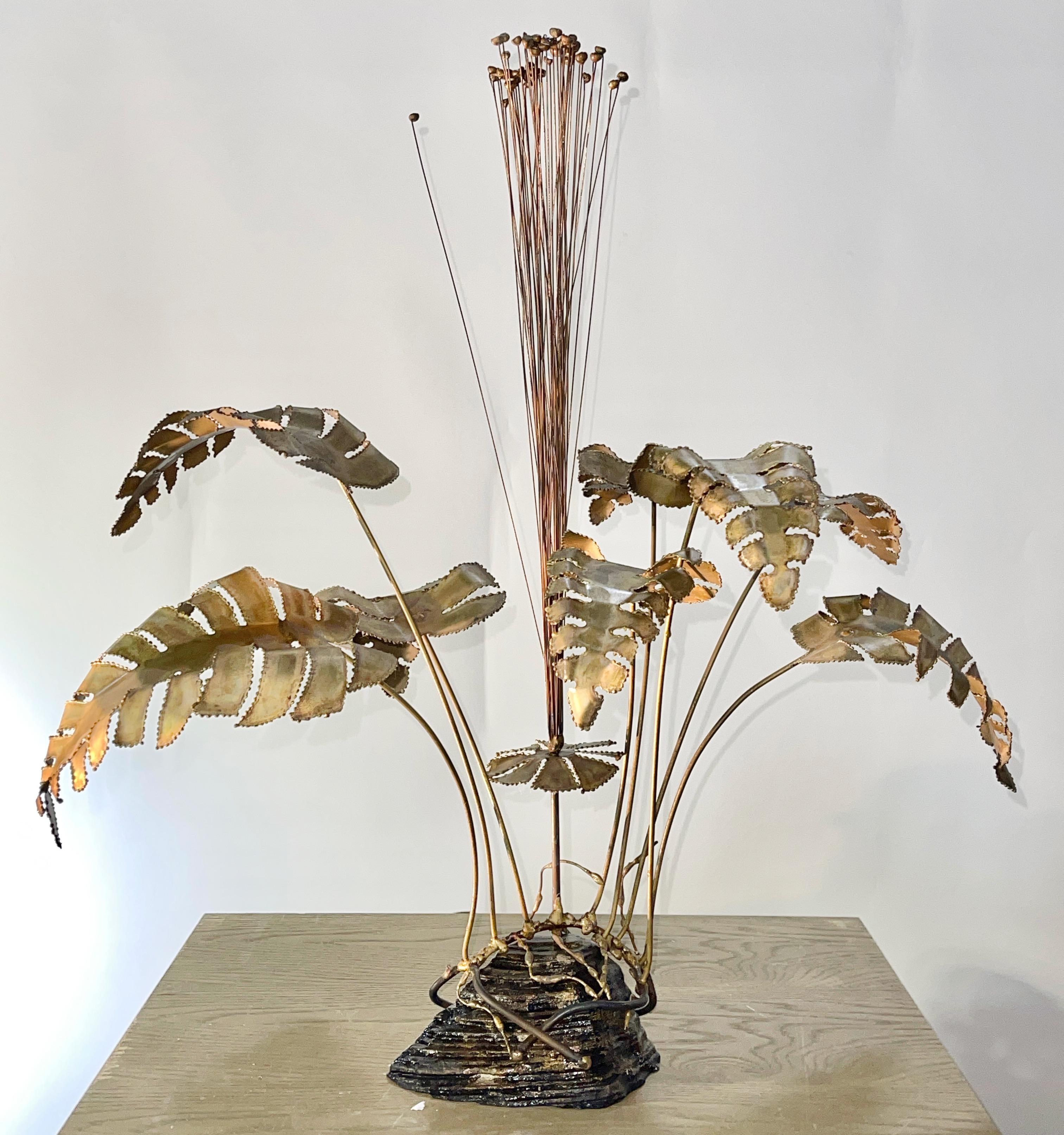 Torch cut brass and mixed metal kinetic floral spray in the style of Curtis Jere retailed through Brotman's Village Fair in Sausalito, CA circa 1970