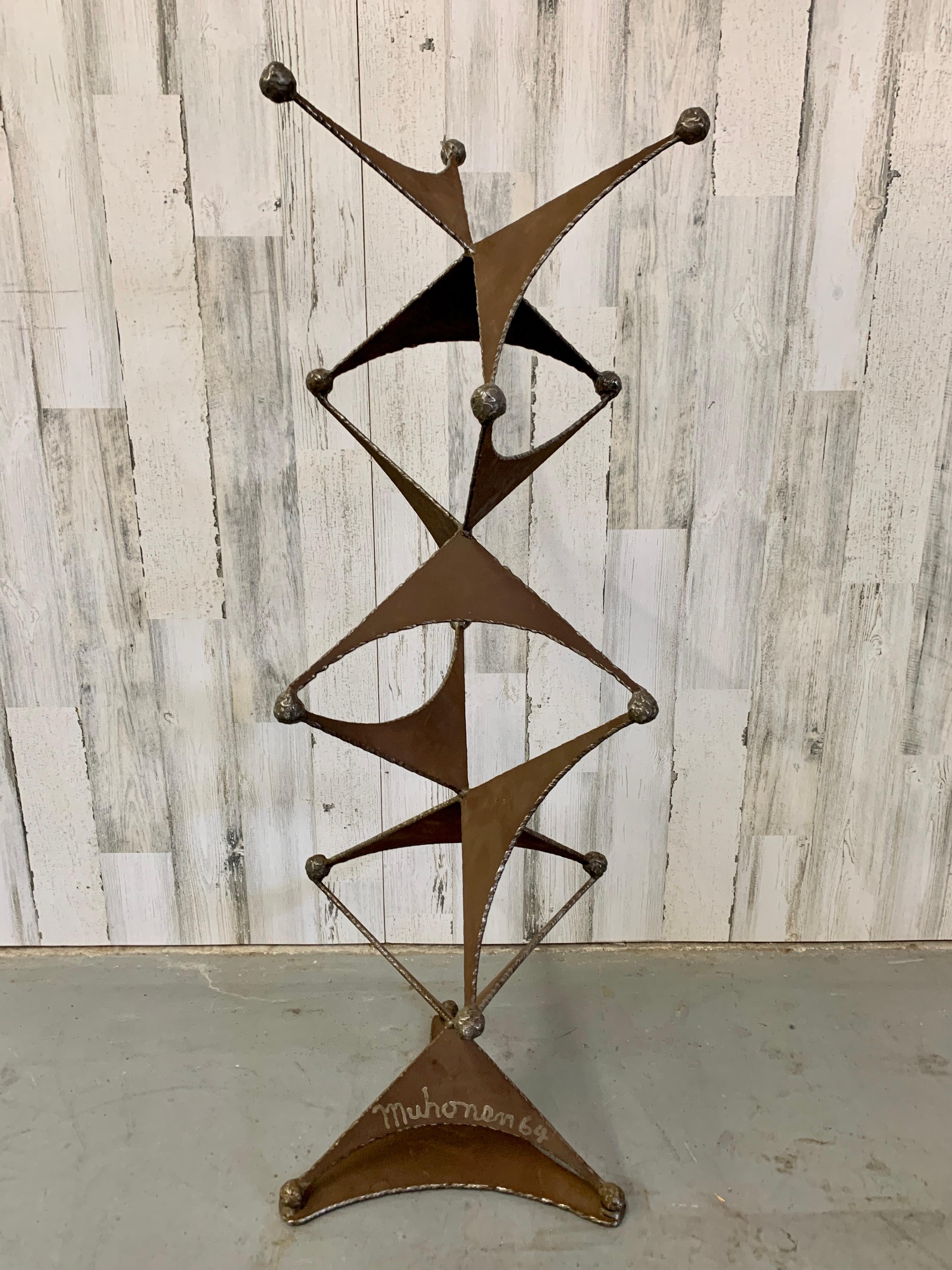 Large steel sculpture very sturdy perfect for garden art or inside the home. These stacked jax appear to be dancing in a playful manner. Artist is unknown.