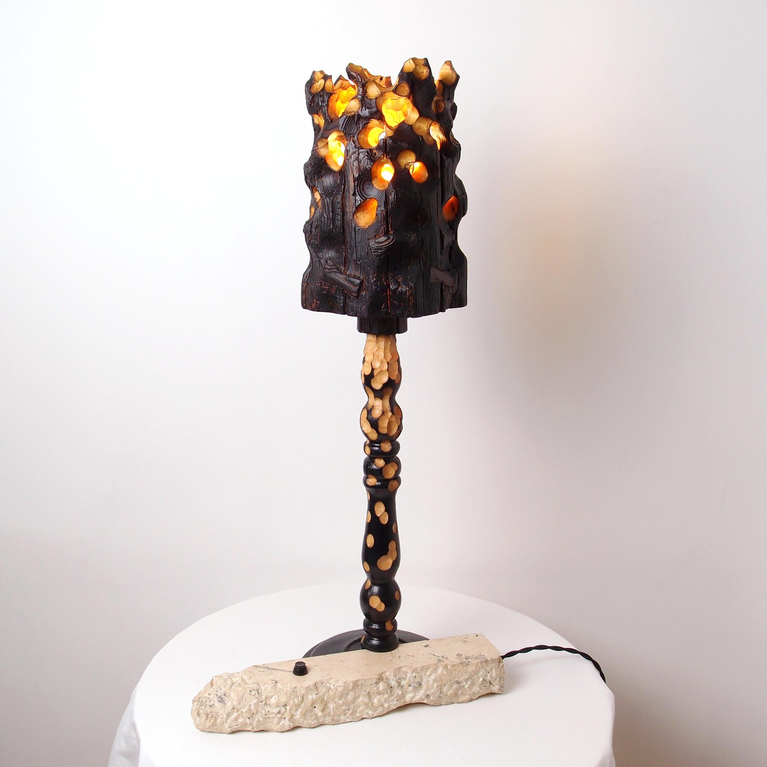 Torch Table Lamp by Gabor Gobi
Unique Piece.
Dimensions: D 17 x W 37 x H 70 cm.
Materials: Pine wood, beech wood, and limestone.

Reimagined from reclaimed wood and residual limestone, this table lamp is a testament to sustainable elegance. Its
