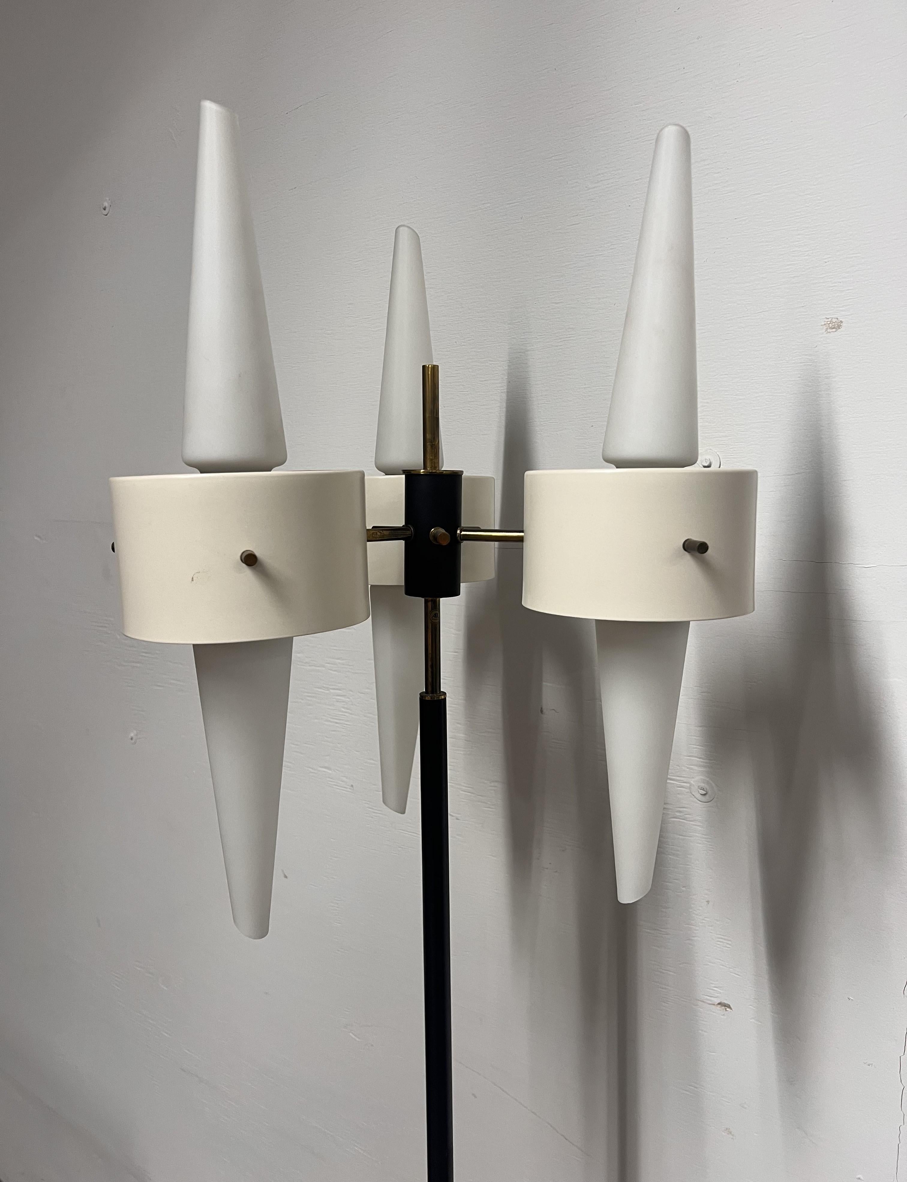 Beautiful floor lamp with frosted glass, enameled brass and a marble base.
Each set of glass is surrounded by a white enameled band.
There are many unique details throughout. 
Needs to be rewired. 