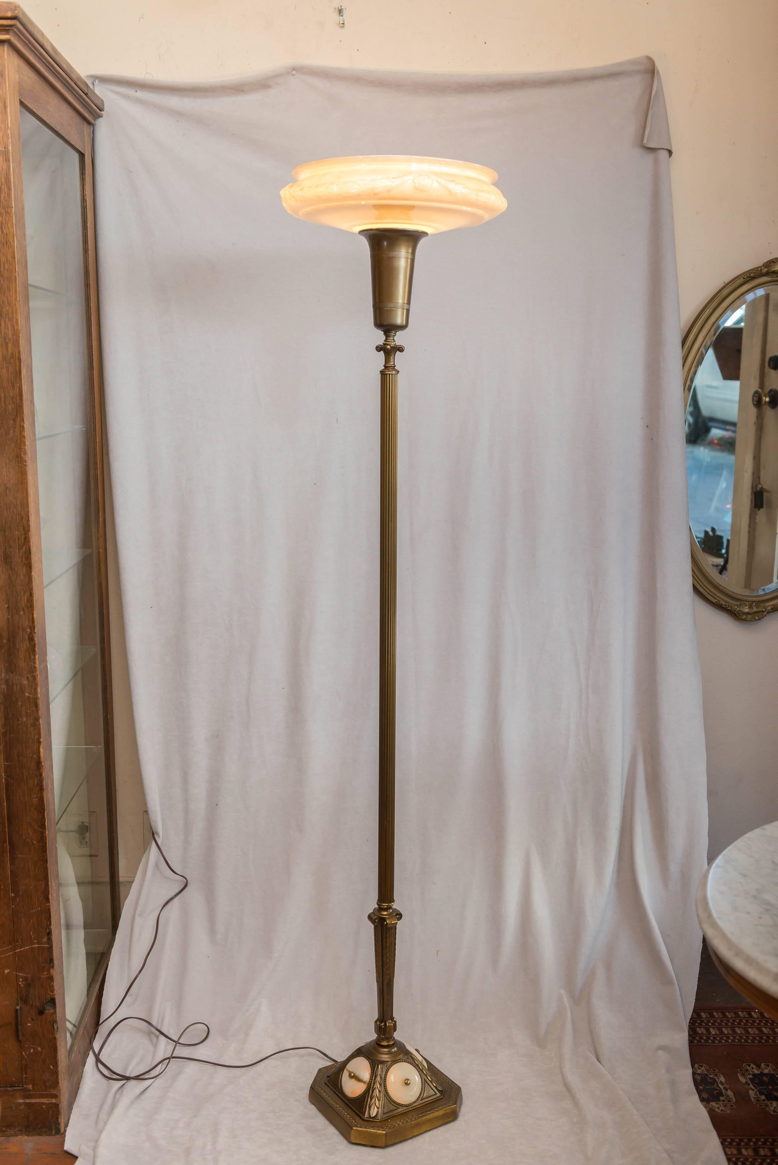 We have sold dozens of floor lamps of this basic design, but we rarely get any with bases that light up. Those nice onyx disc really help make this a better example. Takes a three-way light up bulb. Newly wired, and ready for use.