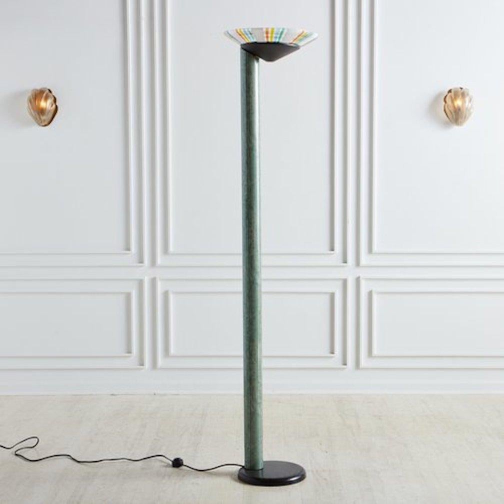 A unique 1960s floor lamp attributed to Relco Italia. This lamp features a hand blown torchiere shade with a linear rainbow design, which sits in a conical black metal base. It has a tubular green laminate body with a stylized marble pattern and
