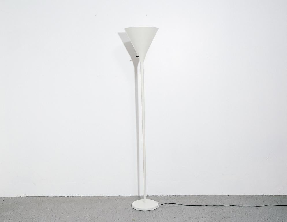 Vintage white torchiere lamp by Von Nessen Studios. Subtly-Space Age in appearance, but minimal enough to suit almost any space.