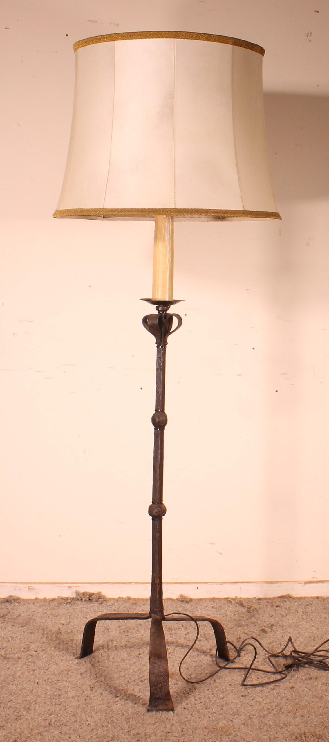 Superb 19th century wrought iron torchiere / floor lamp composed of 17th century elements
The floor lamp has been electrified and has a goatskin lampshade

Very beautiful model.