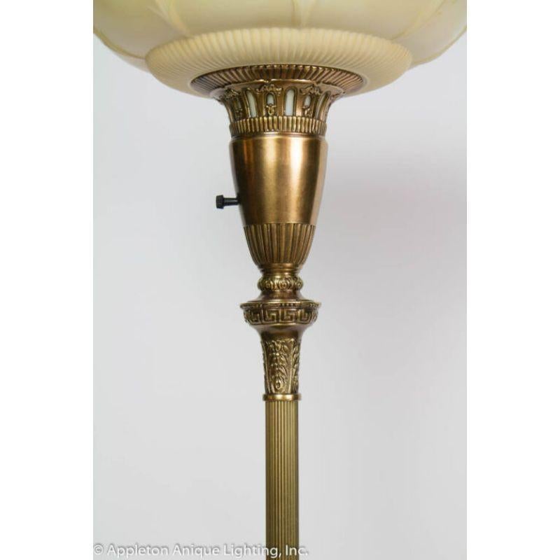Torchiere with Onyx Base and Original Glass Shade. Base has fancy details. Roped tube up lamp.  300Watt max

Material: Brass,Glass
Style: Traditional,Hollywood Regency
Place of Origin: United States
Period made: Mid 20th Century
Dimensions: 16 × 16