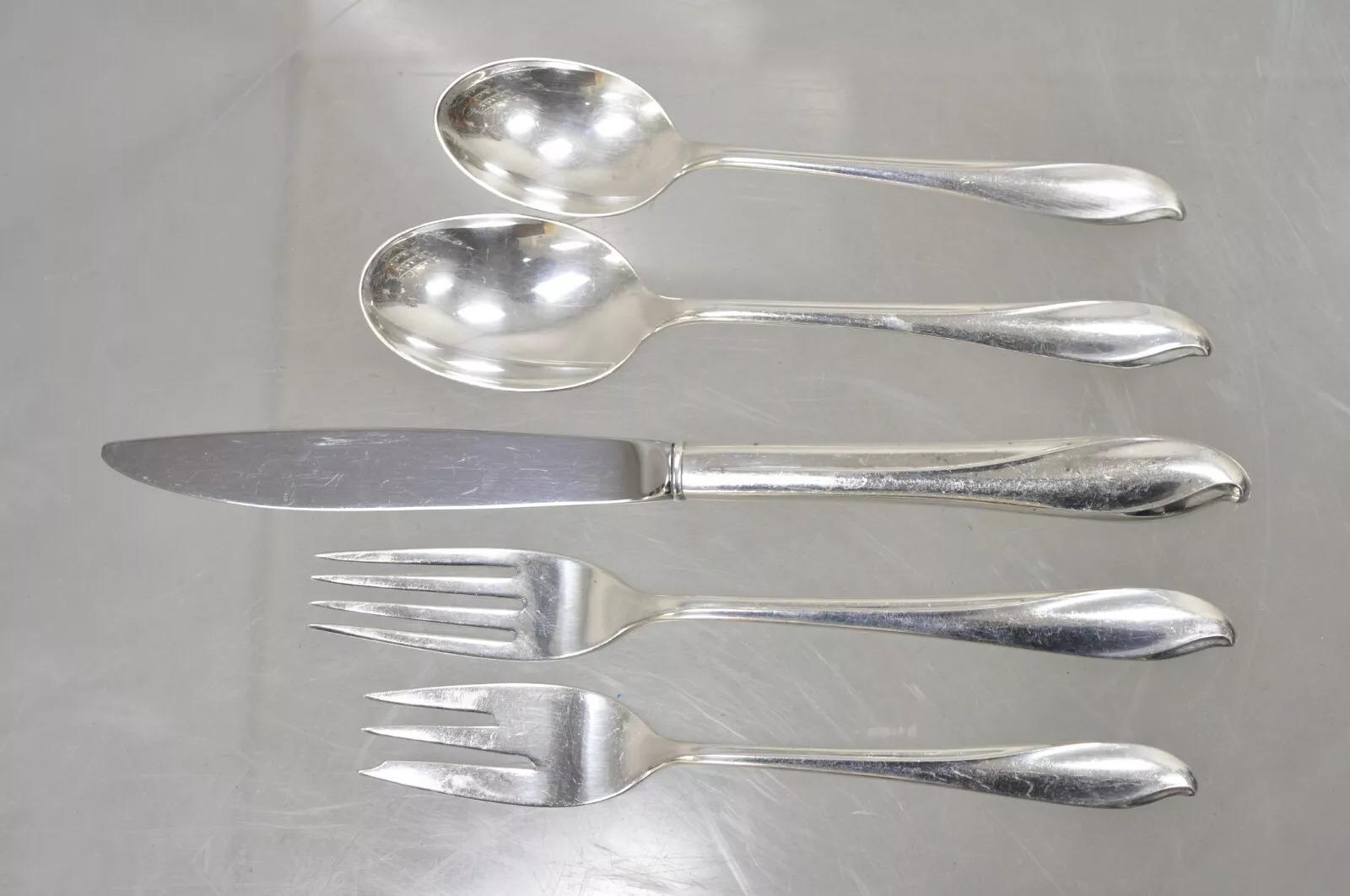 Torchlight by International Sterling Silver Flatware Set Service for 8 - 40 Pcs. Listing includes (5) sets of service for (8). Each set includes (1) soup spoon, (1) teaspoon, (1) dinner fork (1) seafood/cocktail fork, (1) butter knife. Circa Mid