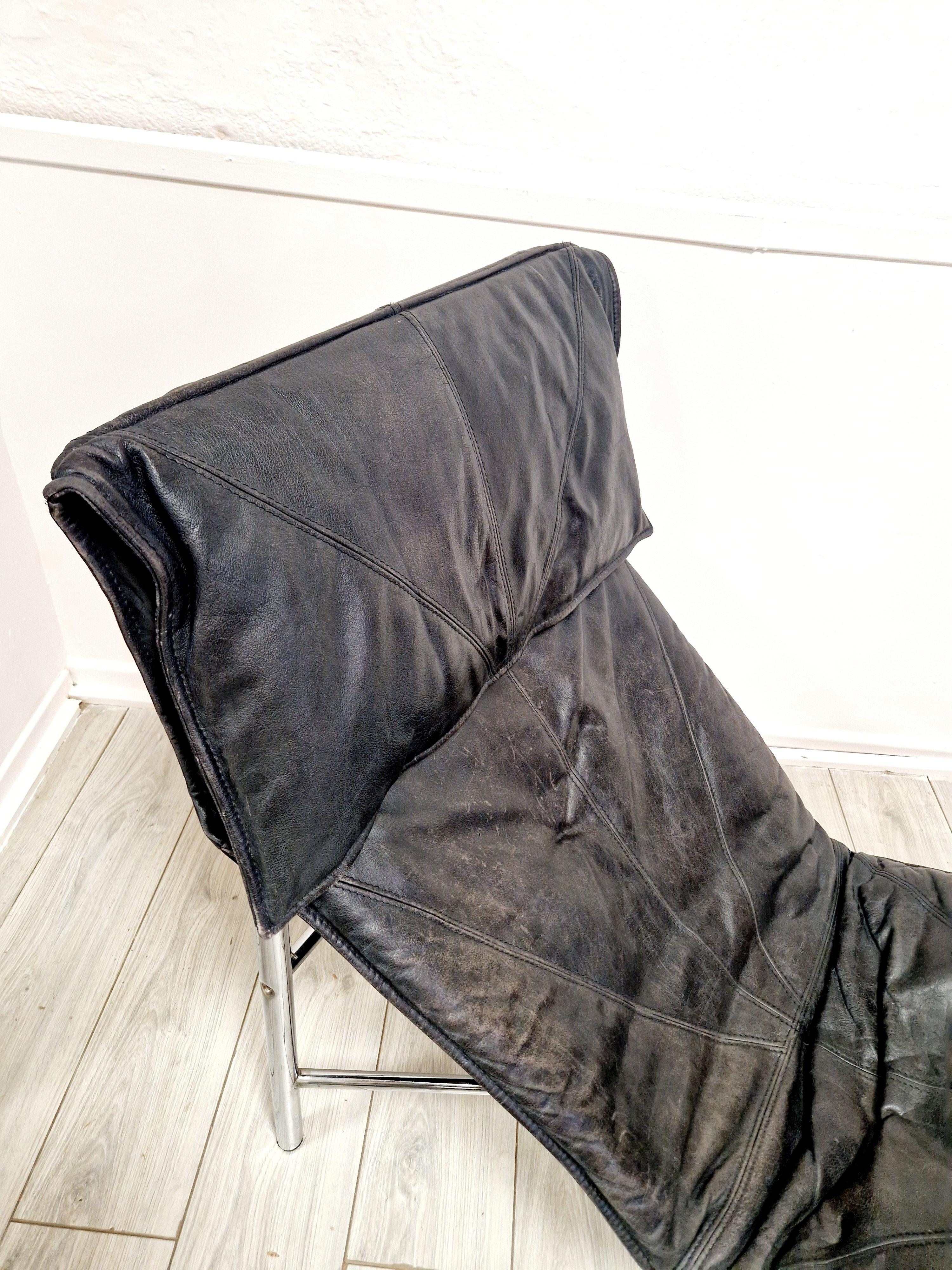 Experience the epitome of vintage elegance with the Tord Bjorklund Swedish Skye Lounger Chair. A true gem from the 1970s, this chaise longue embodies the quintessence of mid-century modern style, complete with sleek chrome accents and luxurious