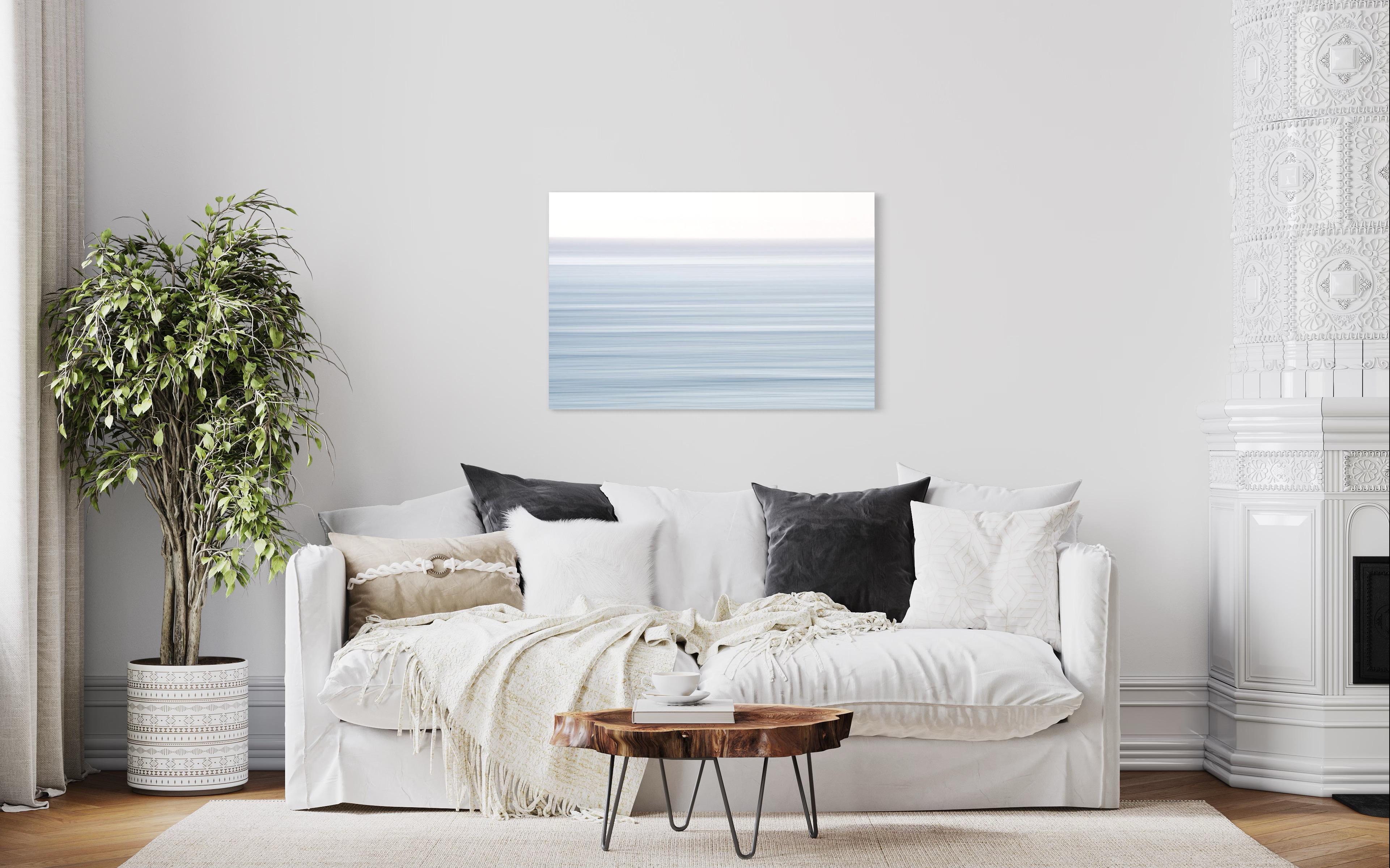 This photograph by Tori Gagne features an abstracted landscape composition and a light blue-grey and white palette. An edition size of 50, this photograph is available as a metal sublimation print with a 1.3” deep silver flush mount frame and white