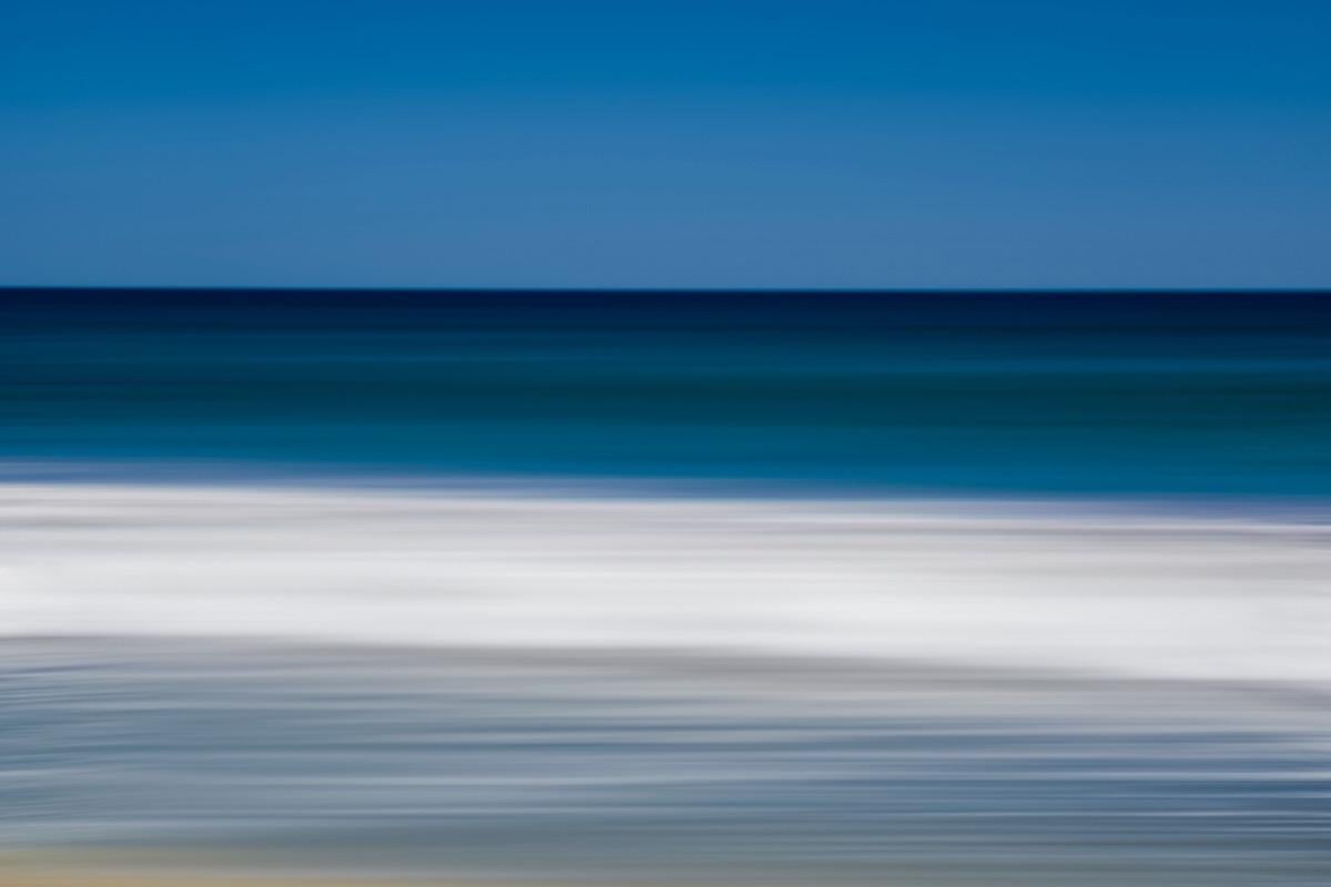 This photograph by Tori Gagne features an abstracted landscape composition and a coastal blue and white palette. An edition size of 50, this photograph by Tori Gagne is available as a metal sublimation print with a 1.3” deep silver flush mount frame