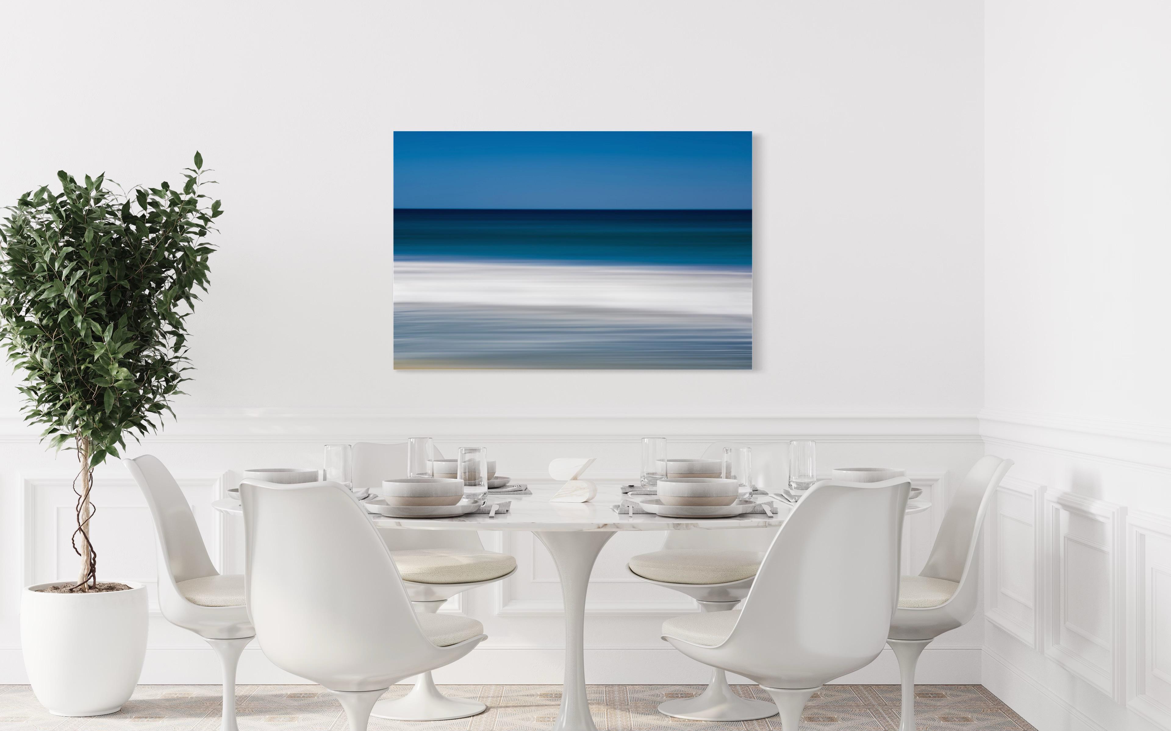 This photograph by Tori Gagne features an abstracted landscape composition and a coastal blue and white palette. An edition size of 25, this photograph by Tori Gagne is available as a metal sublimation print with a 1.3” deep silver flush mount frame