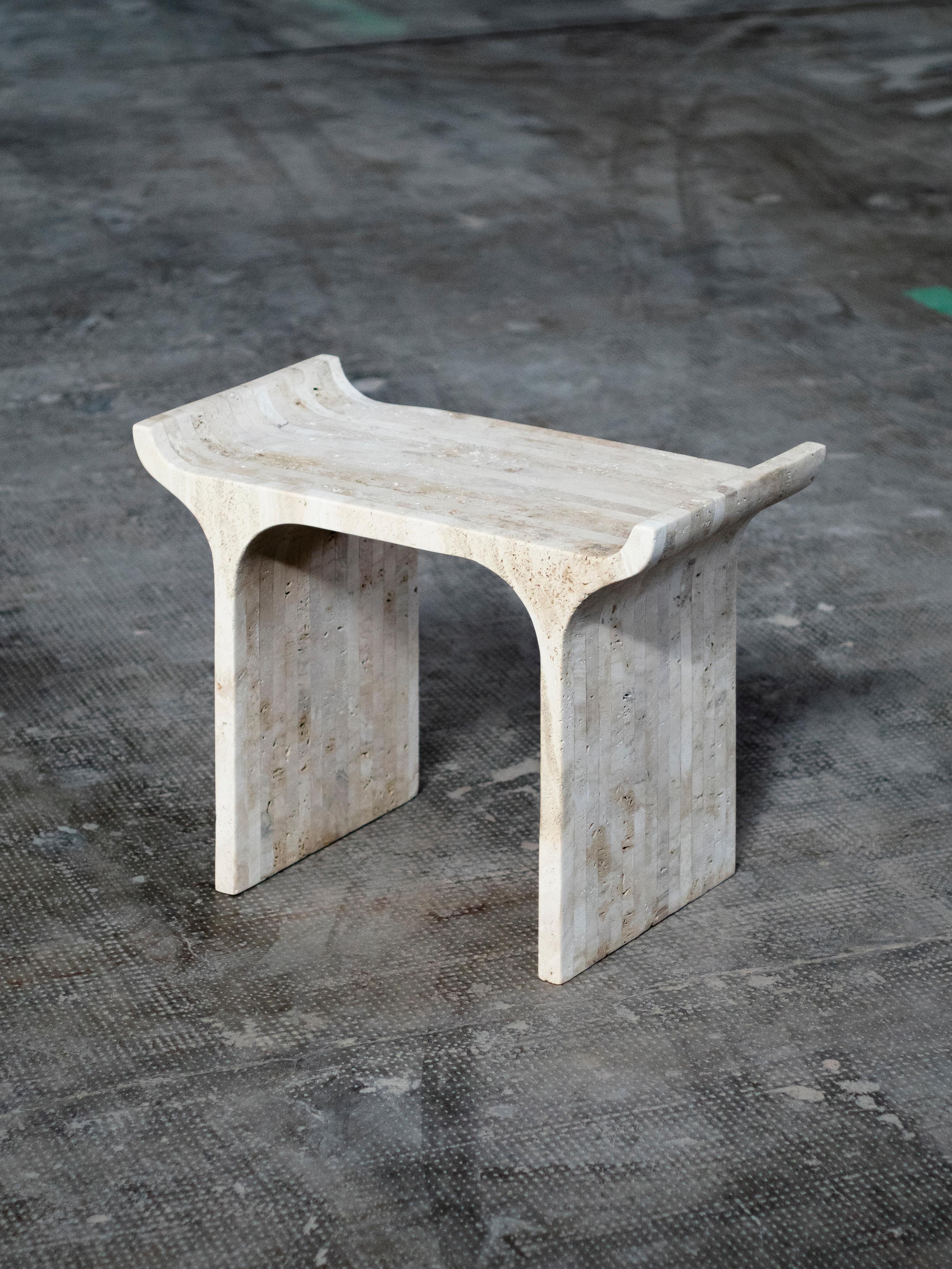 Tori stool Travertine by Ries
Dimensions: W60 x D30 x H44 cm 
Materials: Travertine

Also Available: Tori Stool Sand Cast Aluminum.

Ries is a design studio based in Buenos Aires, Argentina, focused on product and conemporary furniture design. The