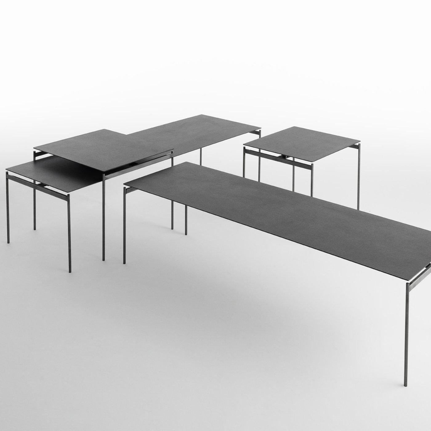 This set of two coffee tables is a minimal and sophisticated piece of functional decor designed by Renato Zamberlan boasting a post-industrial allure. Inspired by the Orient (a Torii is the traditional Japanese gateway that leads to a Shinto shrine