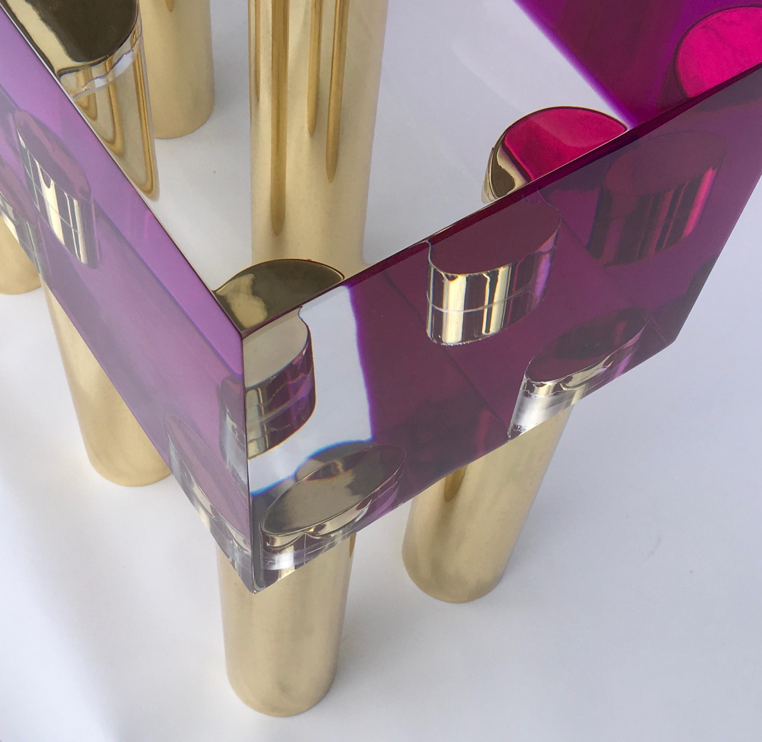 A beautiful bench or coffee table in transparent plexiglass with color pink and with ten brass legs designed and produced by Studio Superego in 2018.

Biography:
Superego editions was born in 2006, performing a constant activity of research in