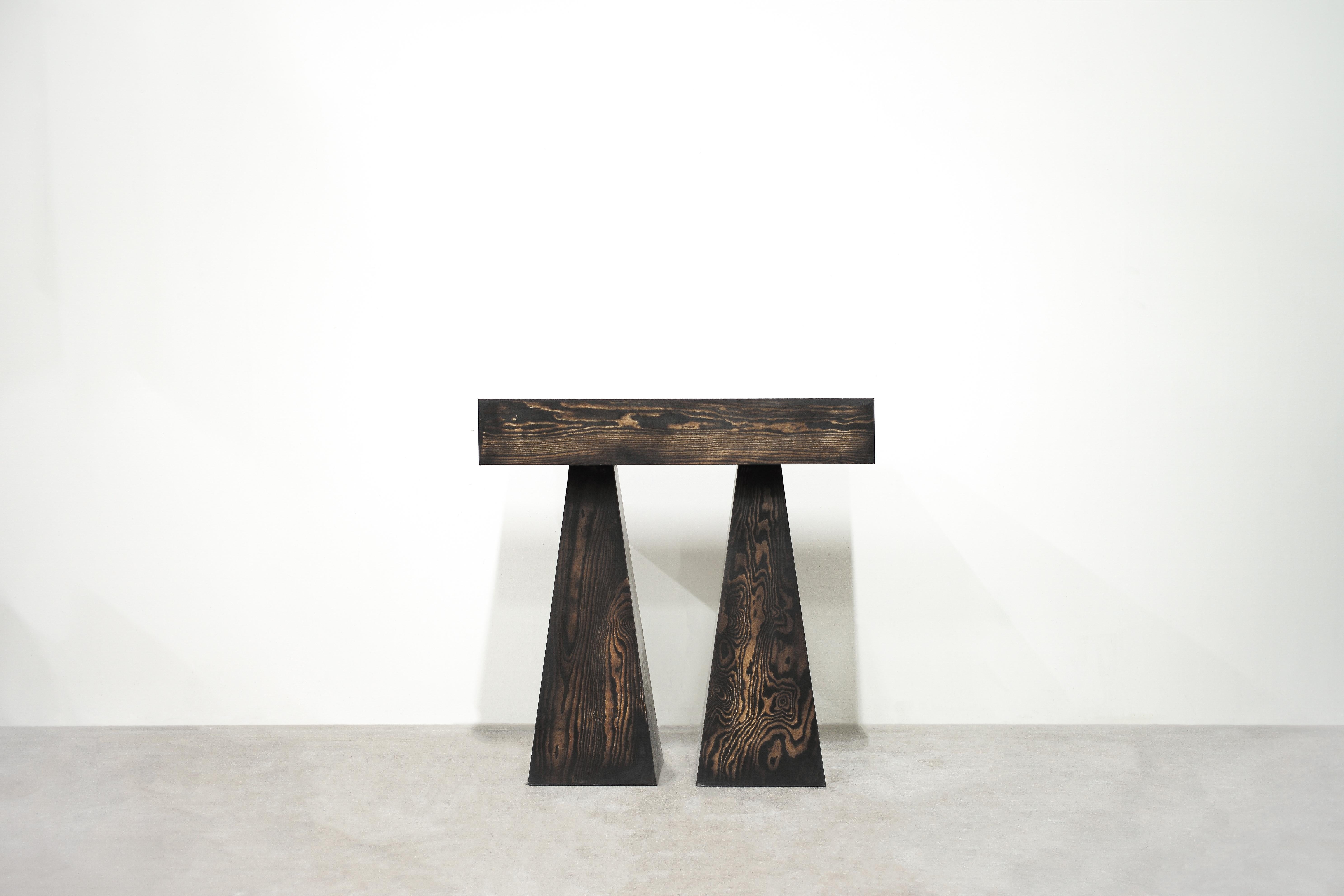 Torn console table in melange by Lucas Tyra Morten
2023
Limited Edition of 12
Dimensions: D 40 x W 90.5 x H 89 cm.
Material: Polished waxed plywood with pigmented linseed oil wax.

Torn table with its two individual legs symbolizes the constant
