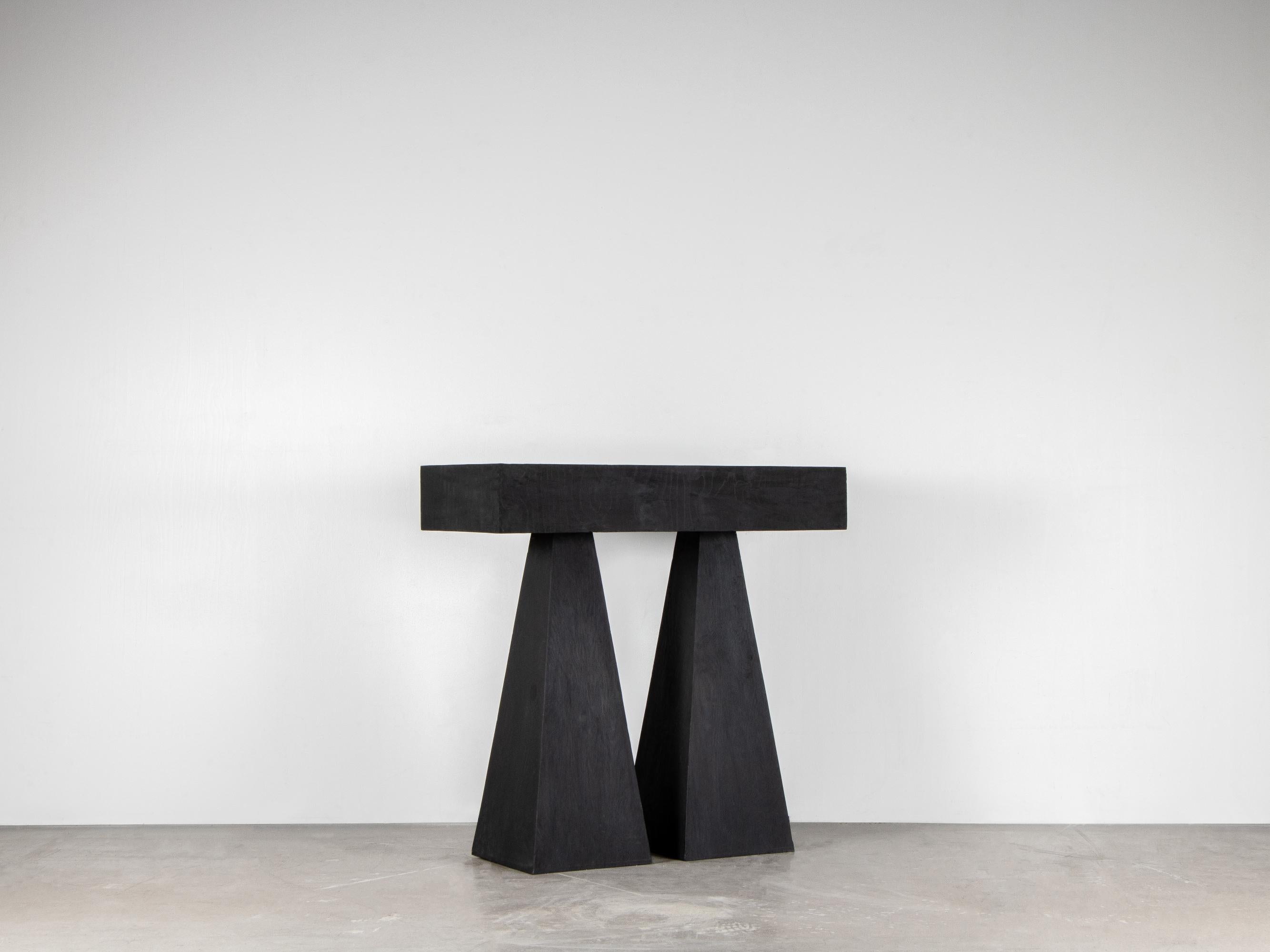 Torn high console table by Lucas Morten
2018
Limited Edition of 29
Dimensions: W 90.5, H 89, D 40
Material: handwaxed plywood

Torn table with its two individual legs symbolizes the constant struggle to maintain the right equilibrium between