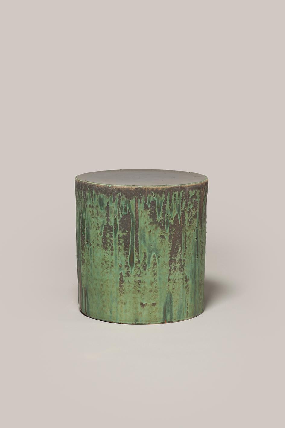 Handmade stoneware side table manufactured at the workshop of Apparatu in Barcelona. Different clay bodys are mixed with natural fibers like corn, straw, or heather straw. The pieces are casted by hand, creating a thick and strong clay structure.